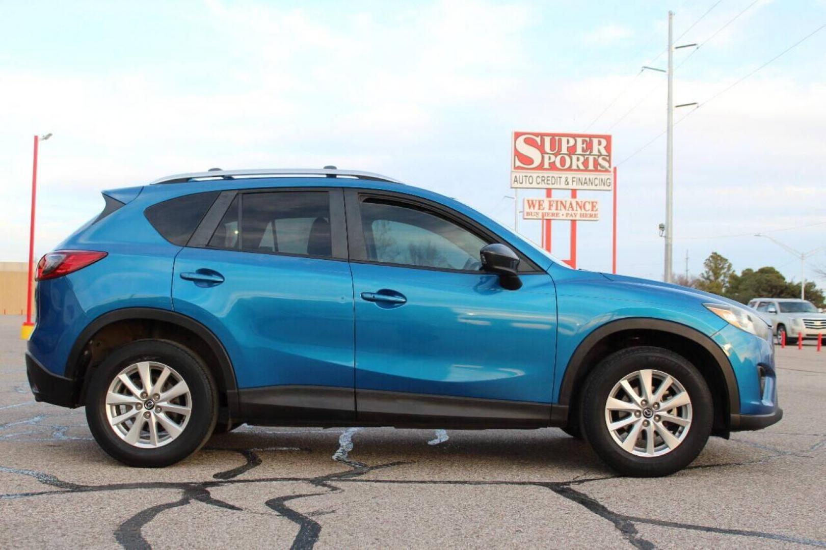2014 Blue Mazda CX-5 Grand Touring (JM3KE2DY0E0) with an 2.5L L4 DOHC 16V engine, 6-Speed Automatic transmission, located at 4301 NW 39th , Oklahoma City, OK, 73112, (405) 949-5600, 35.512135, -97.598671 - Photo#3