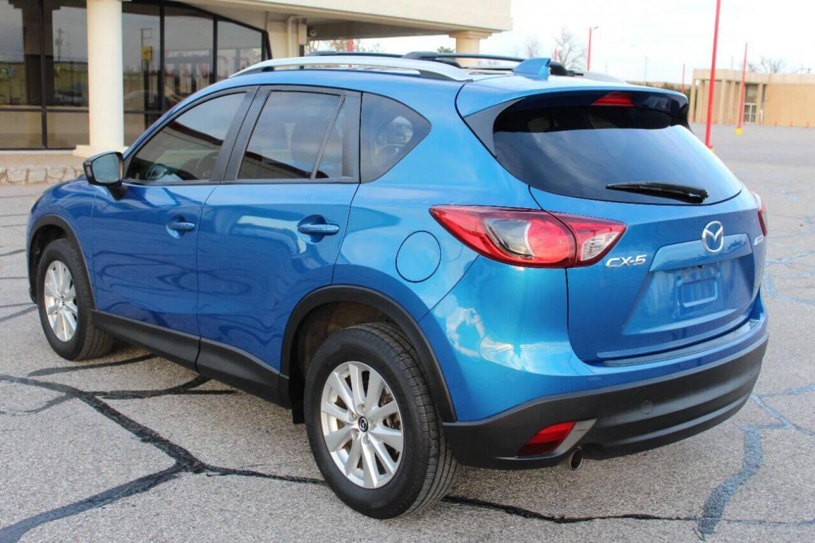 2014 Blue Mazda CX-5 Grand Touring (JM3KE2DY0E0) with an 2.5L L4 DOHC 16V engine, 6-Speed Automatic transmission, located at 4301 NW 39th , Oklahoma City, OK, 73112, (405) 949-5600, 35.512135, -97.598671 - Photo#5