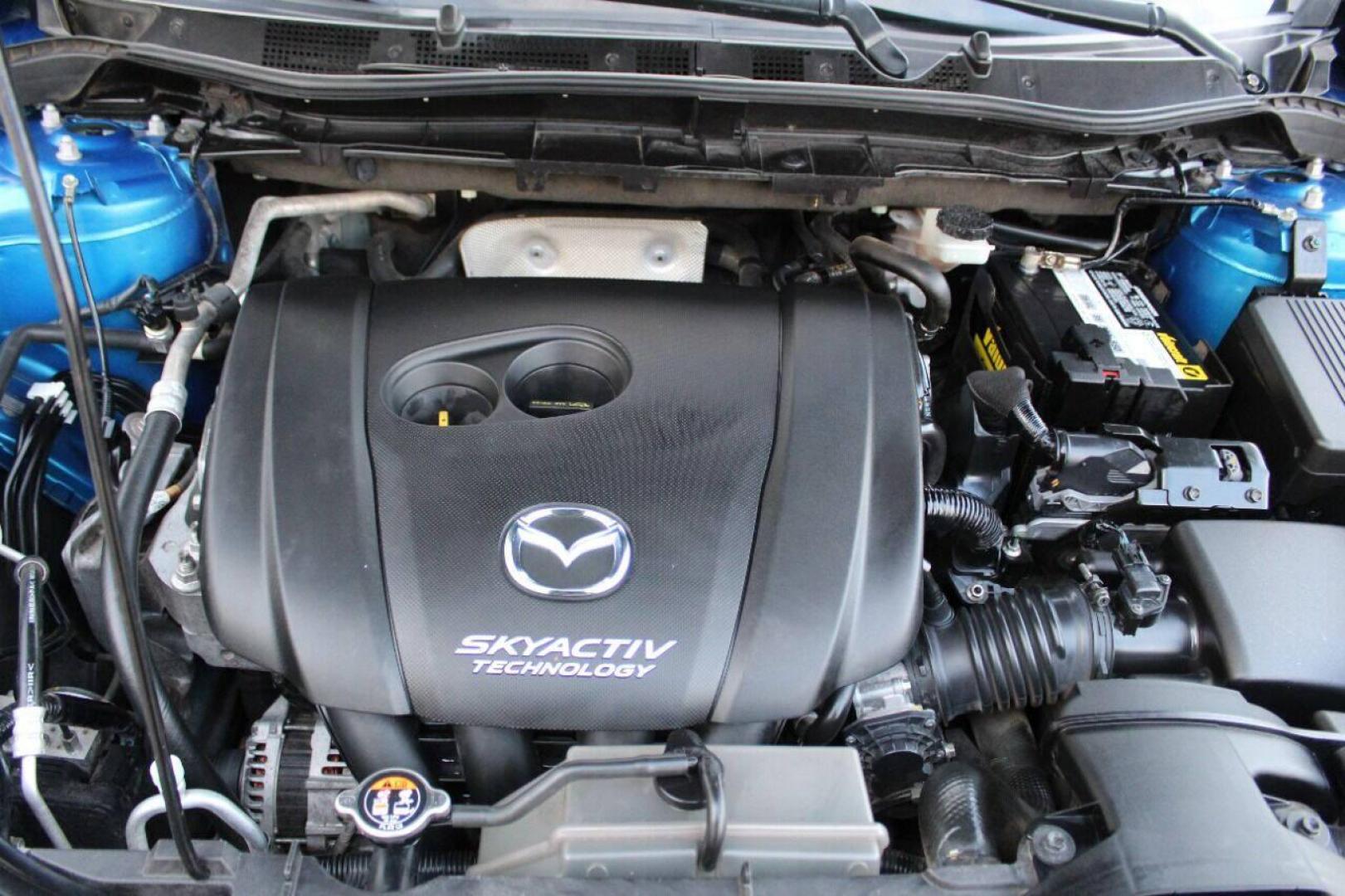 2014 Blue Mazda CX-5 Grand Touring (JM3KE2DY0E0) with an 2.5L L4 DOHC 16V engine, 6-Speed Automatic transmission, located at 4301 NW 39th , Oklahoma City, OK, 73112, (405) 949-5600, 35.512135, -97.598671 - Photo#7