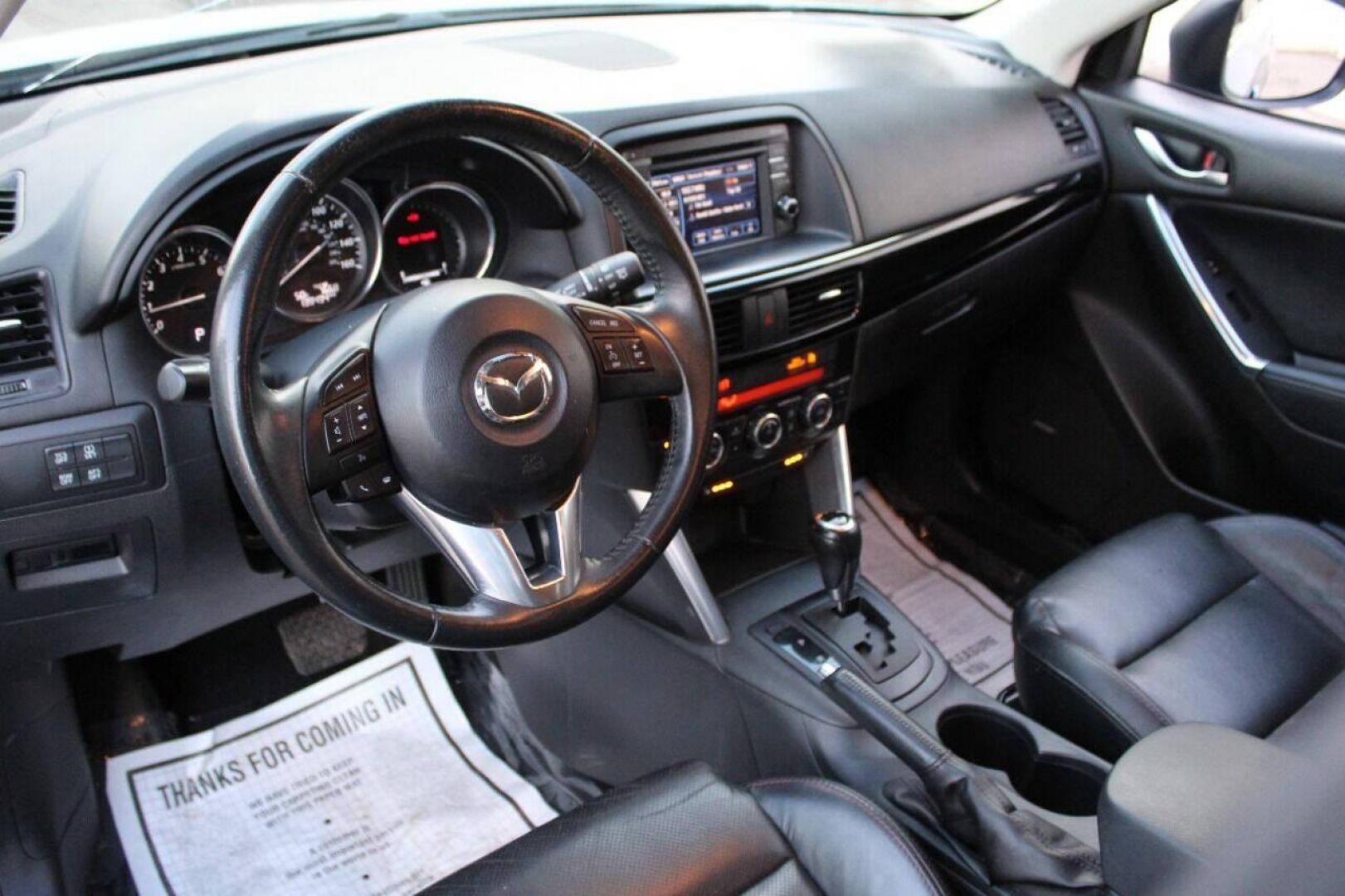 2014 Blue Mazda CX-5 Grand Touring (JM3KE2DY0E0) with an 2.5L L4 DOHC 16V engine, 6-Speed Automatic transmission, located at 4301 NW 39th , Oklahoma City, OK, 73112, (405) 949-5600, 35.512135, -97.598671 - Photo#16