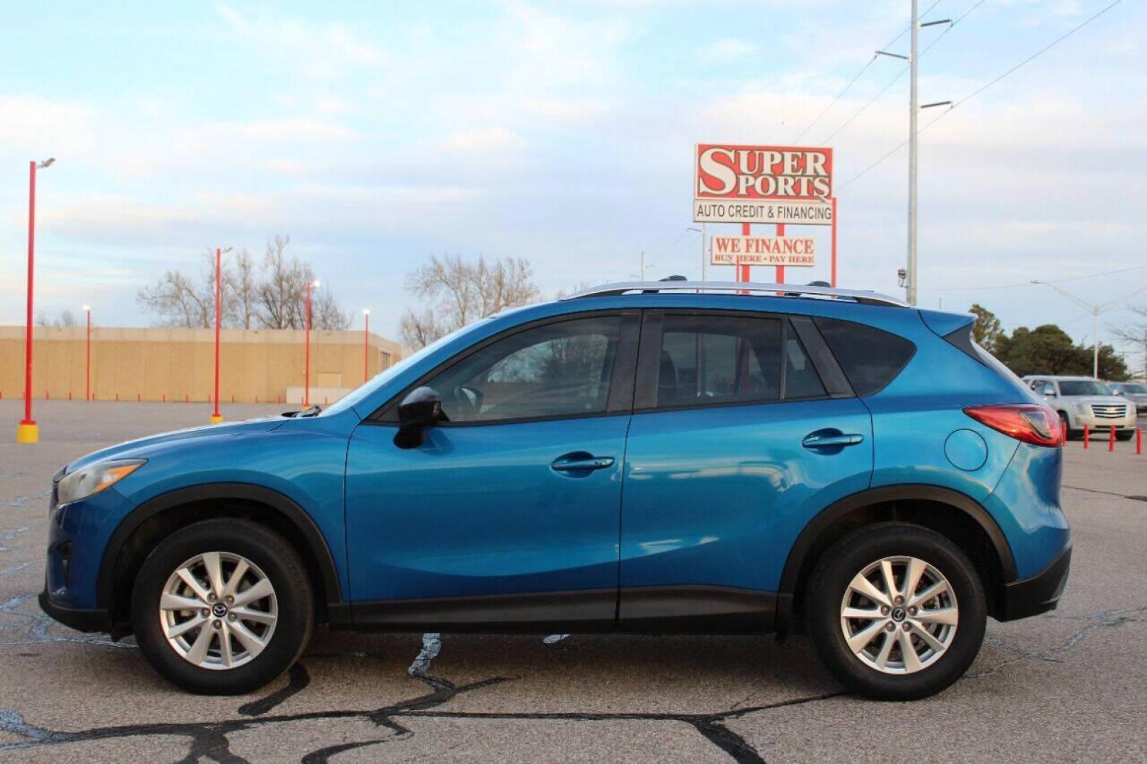 2014 Blue Mazda CX-5 Grand Touring (JM3KE2DY0E0) with an 2.5L L4 DOHC 16V engine, 6-Speed Automatic transmission, located at 4301 NW 39th , Oklahoma City, OK, 73112, (405) 949-5600, 35.512135, -97.598671 - Photo#6