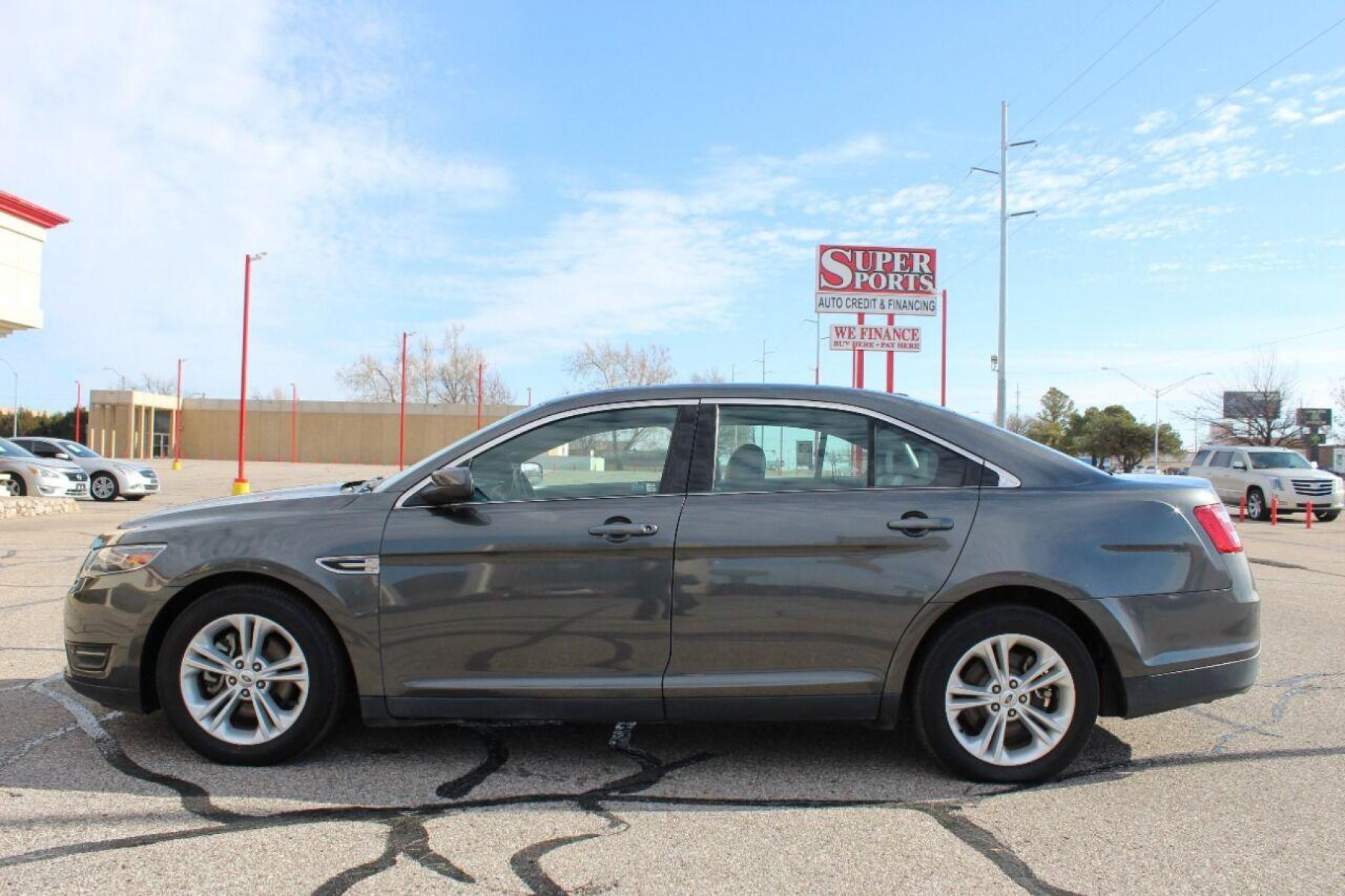 2015 Gray Ford Taurus (1FAHP2E86FG) with an 3.5L V6 3.5L V6 engine, Automatic 6-Speed transmission, located at 4301 NW 39th , Oklahoma City, OK, 73112, (405) 949-5600, 35.512135, -97.598671 - NO DRIVERS LICENCE NO-FULL COVERAGE INSURANCE-NO CREDIT CHECK. COME ON OVER TO SUPERSPORTS AND TAKE A LOOK AND TEST DRIVE PLEASE GIVE US A CALL AT (405) 949-5600. NO LICENSIA DE MANEJAR- NO SEGURO DE COBERTURA TOTAL- NO VERIFICACCION DE CREDITO. POR FAVOR VENGAN A SUPERSPORTS, E - Photo #4