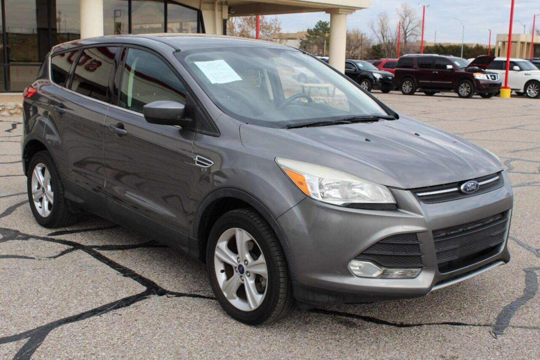 2014 Gray Ford Escape (1FMCU0GX4EU) with an 1.6L I4 Turbocharger 1.6L I4 engine, Automatic 6-Speed transmission, located at 4301 NW 39th , Oklahoma City, OK, 73112, (405) 949-5600, 35.512135, -97.598671 - NO DRIVERS LICENCE NO-FULL COVERAGE INSURANCE-NO CREDIT CHECK. COME ON OVER TO SUPERSPORTS AND TAKE A LOOK AND TEST DRIVE PLEASE GIVE US A CALL AT (405) 949-5600. NO LICENSIA DE MANEJAR- NO SEGURO DE COBERTURA TOTAL- NO VERIFICACCION DE CREDITO. POR FAVOR VENGAN A SUPERSPORTS, E - Photo #2