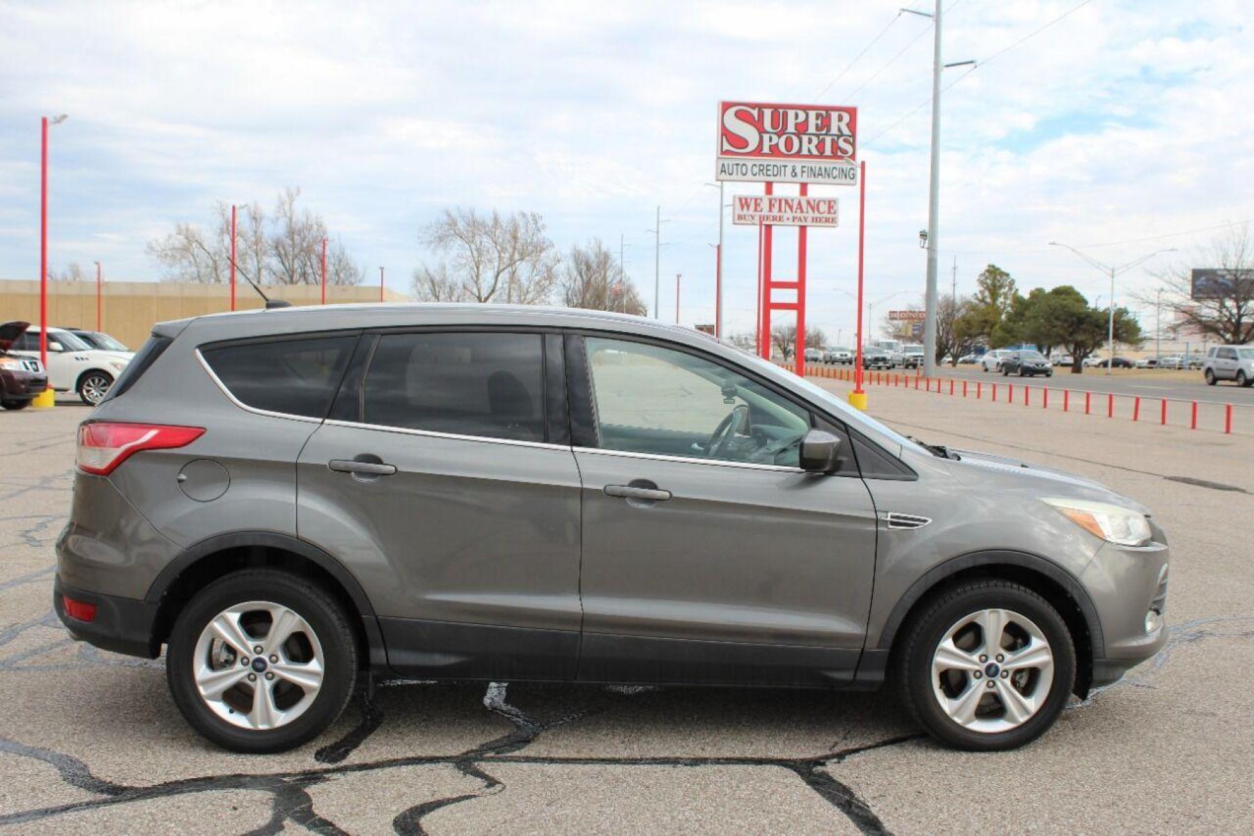 2014 Gray Ford Escape (1FMCU0GX4EU) with an 1.6L I4 Turbocharger 1.6L I4 engine, Automatic 6-Speed transmission, located at 4301 NW 39th , Oklahoma City, OK, 73112, (405) 949-5600, 35.512135, -97.598671 - NO DRIVERS LICENCE NO-FULL COVERAGE INSURANCE-NO CREDIT CHECK. COME ON OVER TO SUPERSPORTS AND TAKE A LOOK AND TEST DRIVE PLEASE GIVE US A CALL AT (405) 949-5600. NO LICENSIA DE MANEJAR- NO SEGURO DE COBERTURA TOTAL- NO VERIFICACCION DE CREDITO. POR FAVOR VENGAN A SUPERSPORTS, E - Photo #3