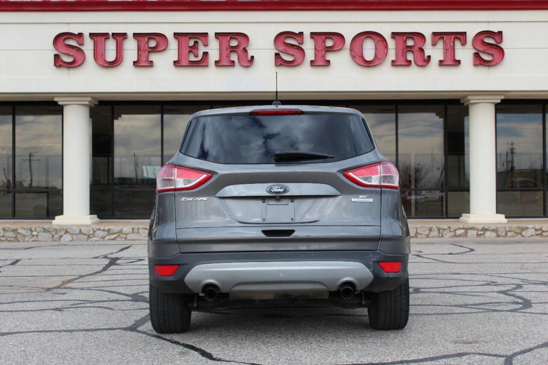 2014 Gray Ford Escape (1FMCU0GX4EU) with an 1.6L I4 Turbocharger 1.6L I4 engine, Automatic 6-Speed transmission, located at 4301 NW 39th , Oklahoma City, OK, 73112, (405) 949-5600, 35.512135, -97.598671 - NO DRIVERS LICENCE NO-FULL COVERAGE INSURANCE-NO CREDIT CHECK. COME ON OVER TO SUPERSPORTS AND TAKE A LOOK AND TEST DRIVE PLEASE GIVE US A CALL AT (405) 949-5600. NO LICENSIA DE MANEJAR- NO SEGURO DE COBERTURA TOTAL- NO VERIFICACCION DE CREDITO. POR FAVOR VENGAN A SUPERSPORTS, E - Photo #4