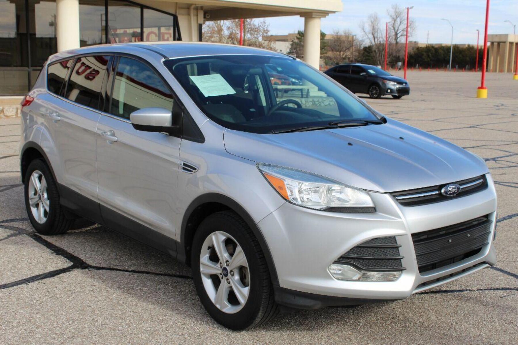 2014 Silver Ford Escape (1FMCU0GX3EU) with an 1.6L I4 Turbocharger 1.6L I4 engine, Automatic 6-Speed transmission, located at 4301 NW 39th , Oklahoma City, OK, 73112, (405) 949-5600, 35.512135, -97.598671 - NO DRIVERS LICENCE NO-FULL COVERAGE INSURANCE-NO CREDIT CHECK. COME ON OVER TO SUPERSPORTS AND TAKE A LOOK AND TEST DRIVE PLEASE GIVE US A CALL AT (405) 949-5600. NO LICENSIA DE MANEJAR- NO SEGURO DE COBERTURA TOTAL- NO VERIFICACCION DE CREDITO. POR FAVOR VENGAN A SUPERSPORTS, E - Photo #2