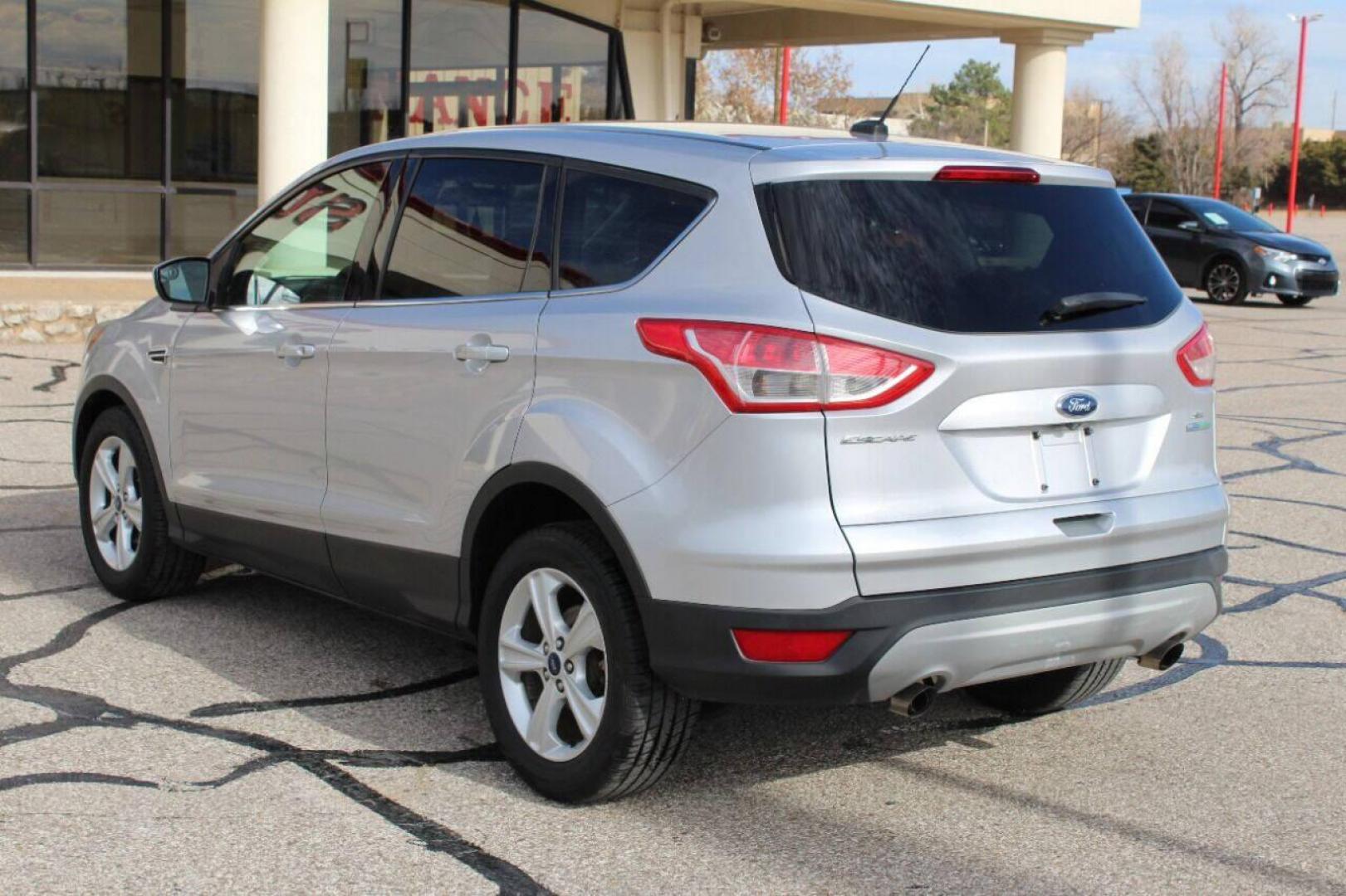 2014 Silver Ford Escape SE FWD (1FMCU0GX3EU) with an 1.6L L4 DOHC 16V engine, 6-Speed Automatic transmission, located at 4301 NW 39th , Oklahoma City, OK, 73112, (405) 949-5600, 35.512135, -97.598671 - NO DRIVERS LICENCE NO-FULL COVERAGE INSURANCE-NO CREDIT CHECK. COME ON OVER TO SUPERSPORTS AND TAKE A LOOK AND TEST DRIVE. PLEASE GIVE US A CALL AT (405) 949-5600. NO LICENSIA DE MANEJAR- NO SEGURO DE COBERTURA TOTAL- NO VERIFICACCION DE CREDITO. POR FAVOR VENGAN A SUPERSPORTS, ECHE UN - Photo#5