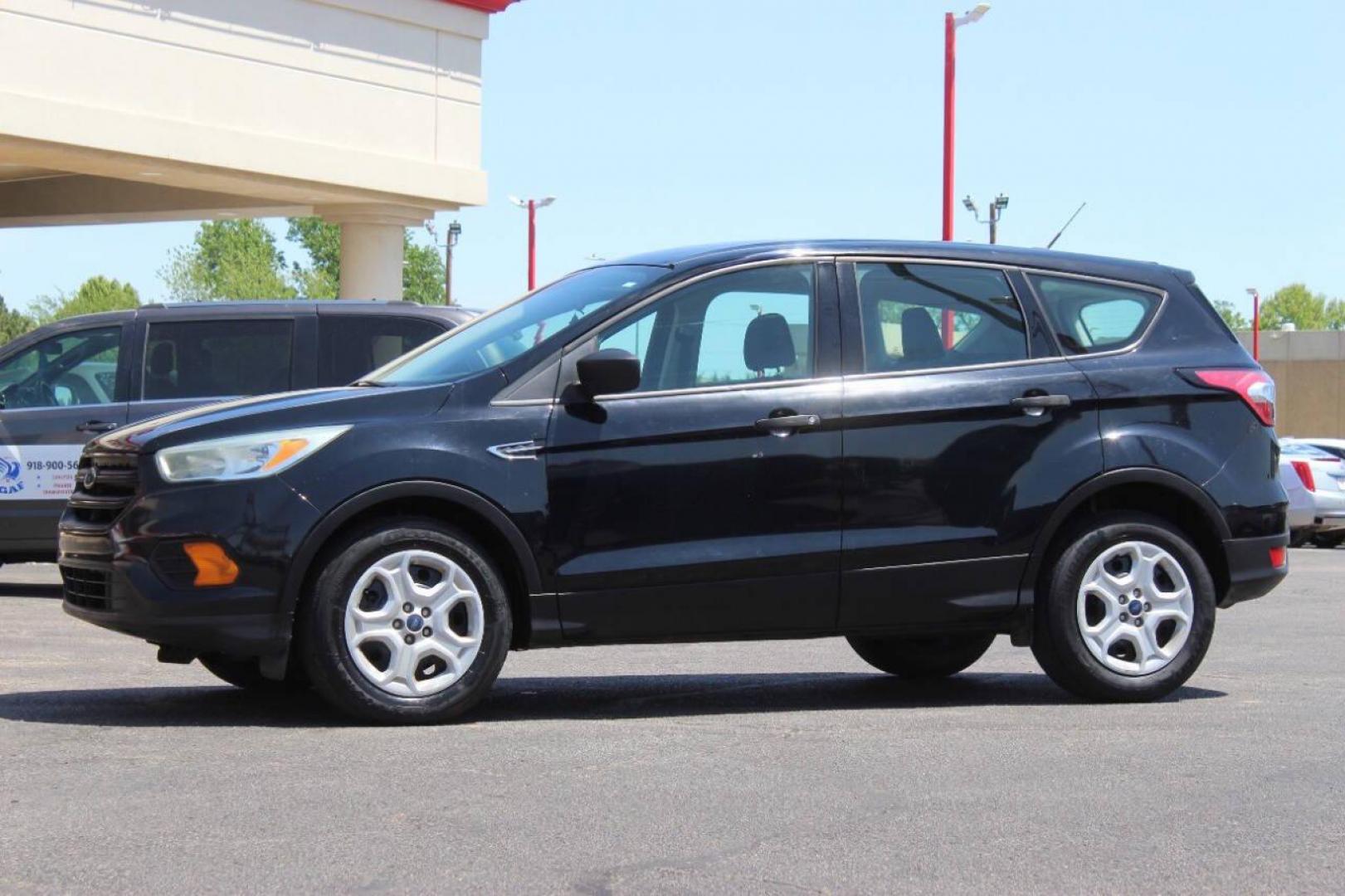 2017 Black Ford Escape S FWD (1FMCU0F73HU) with an 2.5L L4 DOHC 16V engine, 6A transmission, located at 4301 NW 39th , Oklahoma City, OK, 73112, (405) 949-5600, 35.512135, -97.598671 - NO DRIVERS LICENCE NO-FULL COVERAGE INSURANCE-NO CREDIT CHECK. COME ON OVER TO SUPERSPORTS AND TAKE A LOOK AND TEST DRIVE. PLEASE GIVE US A CALL AT (405) 949-5600. NO LICENSIA DE MANEJAR- NO SEGURO DE COBERTURA TOTAL- NO VERIFICACCION DE CREDITO. POR FAVOR VENGAN A SUPERSPORTS, - Photo#5
