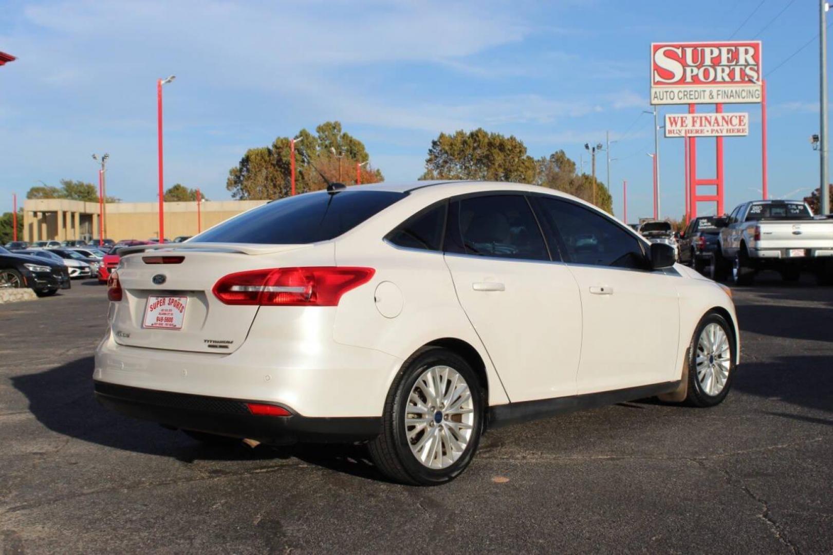 2016 White Ford Focus Titanium Sedan (1FADP3J27GL) with an 2.0L L4 DOHC 16V engine, 6A transmission, located at 4301 NW 39th , Oklahoma City, OK, 73112, (405) 949-5600, 35.512135, -97.598671 - NO DRIVERS LICENCE NO-FULL COVERAGE INSURANCE-NO CREDIT CHECK. COME ON OVER TO SUPERSPORTS AND TAKE A LOOK AND TEST DRIVE PLEASE GIVE US A CALL AT (405) 949-5600. NO LICENSIA DE MANEJAR- NO SEGURO DE COBERTURA TOTAL- NO VERIFICACCION DE CREDITO. POR FAVOR VENGAN A SUPERSPORTS, ECHE UN V - Photo#3
