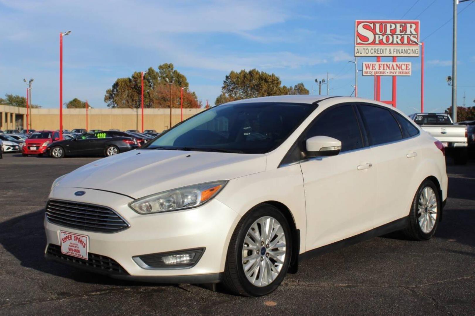 2016 White Ford Focus Titanium Sedan (1FADP3J27GL) with an 2.0L L4 DOHC 16V engine, 6A transmission, located at 4301 NW 39th , Oklahoma City, OK, 73112, (405) 949-5600, 35.512135, -97.598671 - NO DRIVERS LICENCE NO-FULL COVERAGE INSURANCE-NO CREDIT CHECK. COME ON OVER TO SUPERSPORTS AND TAKE A LOOK AND TEST DRIVE PLEASE GIVE US A CALL AT (405) 949-5600. NO LICENSIA DE MANEJAR- NO SEGURO DE COBERTURA TOTAL- NO VERIFICACCION DE CREDITO. POR FAVOR VENGAN A SUPERSPORTS, ECHE UN V - Photo#6