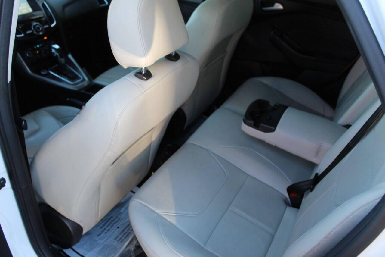 2016 White Ford Focus Titanium Sedan (1FADP3J27GL) with an 2.0L L4 DOHC 16V engine, 6A transmission, located at 4301 NW 39th , Oklahoma City, OK, 73112, (405) 949-5600, 35.512135, -97.598671 - NO DRIVERS LICENCE NO-FULL COVERAGE INSURANCE-NO CREDIT CHECK. COME ON OVER TO SUPERSPORTS AND TAKE A LOOK AND TEST DRIVE PLEASE GIVE US A CALL AT (405) 949-5600. NO LICENSIA DE MANEJAR- NO SEGURO DE COBERTURA TOTAL- NO VERIFICACCION DE CREDITO. POR FAVOR VENGAN A SUPERSPORTS, ECHE UN V - Photo#13