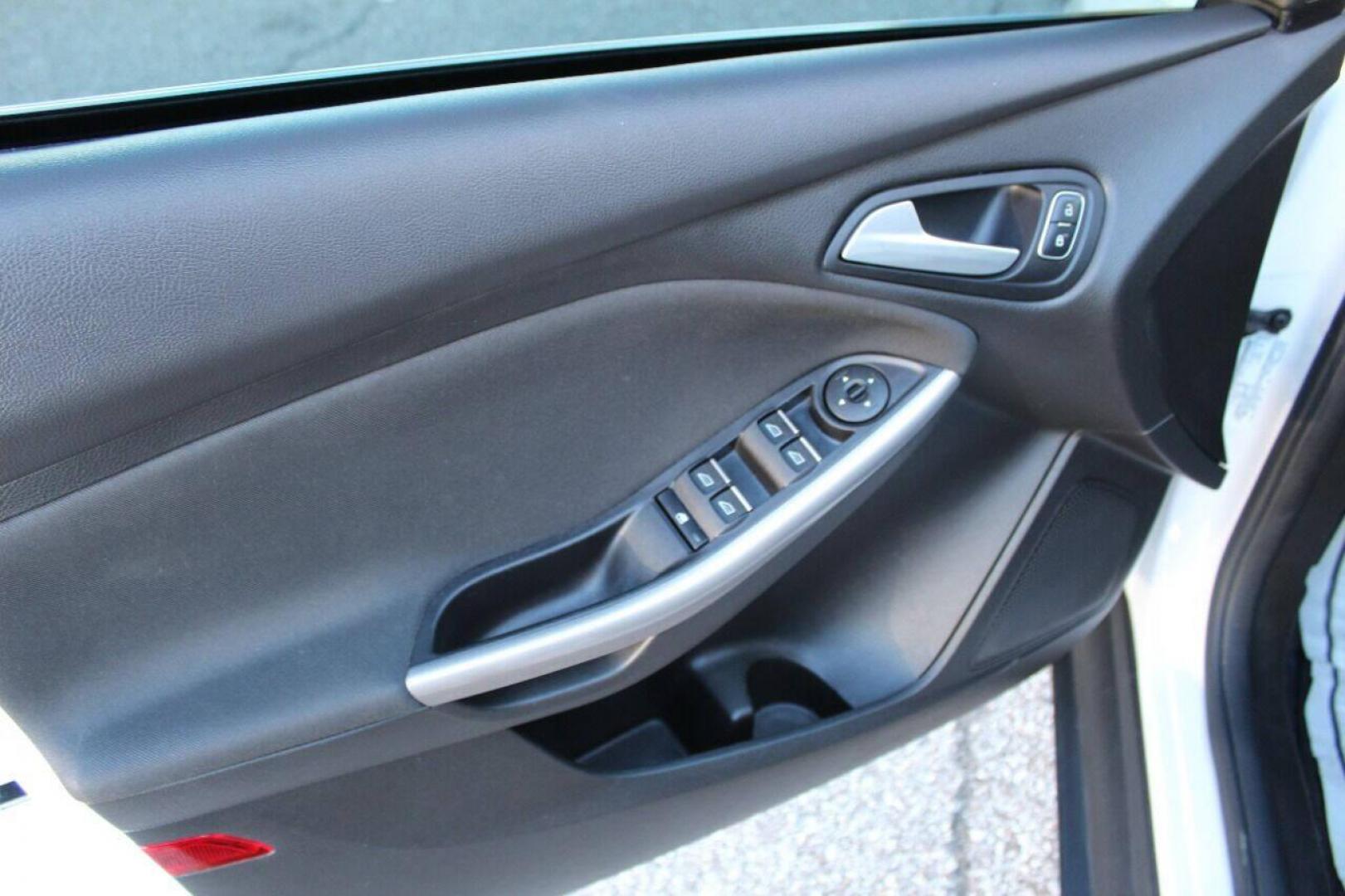 2016 White Ford Focus Titanium Sedan (1FADP3J27GL) with an 2.0L L4 DOHC 16V engine, 6A transmission, located at 4301 NW 39th , Oklahoma City, OK, 73112, (405) 949-5600, 35.512135, -97.598671 - NO DRIVERS LICENCE NO-FULL COVERAGE INSURANCE-NO CREDIT CHECK. COME ON OVER TO SUPERSPORTS AND TAKE A LOOK AND TEST DRIVE PLEASE GIVE US A CALL AT (405) 949-5600. NO LICENSIA DE MANEJAR- NO SEGURO DE COBERTURA TOTAL- NO VERIFICACCION DE CREDITO. POR FAVOR VENGAN A SUPERSPORTS, ECHE UN V - Photo#16