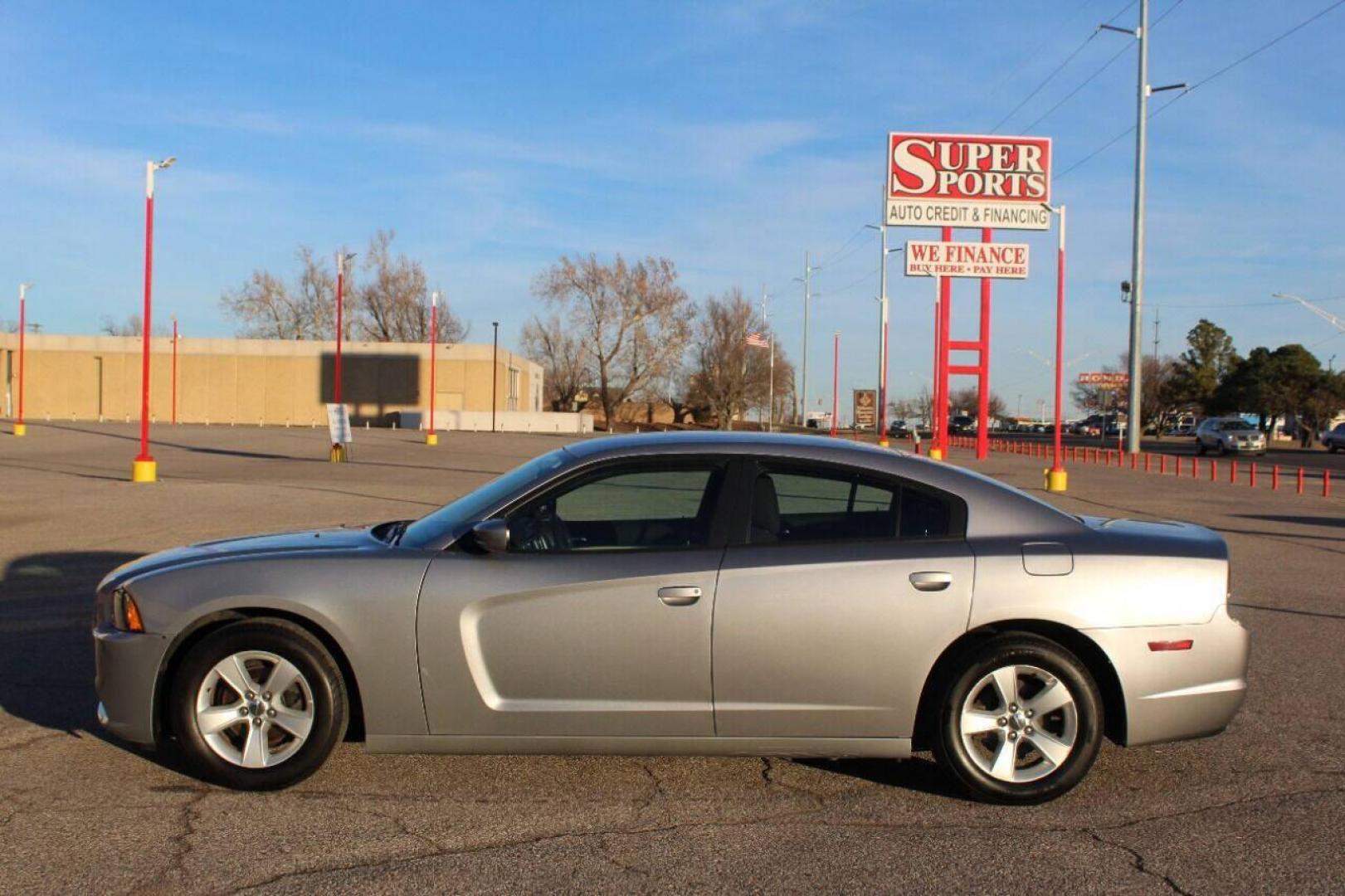 2014 Silver Dodge Charger SE (2C3CDXBG8EH) with an 3.6L V6 DOHC 24V engine, 5-Speed Automatic transmission, located at 4301 NW 39th , Oklahoma City, OK, 73112, (405) 949-5600, 35.512135, -97.598671 - NO DRIVERS LICENSE - NO FULL COVERAGE INSURANCE - NO CREDIT CHECK. COME ON OVER TO SUPERSPORTS AND TAKE A LOOK AND TEST DRIVE PLEASE GIVE US A CALL AT (405) 949-5600. NO LICENCIA DE MANEJAR - NO SEGURO DE COBERTURA TOTAL - NO VERIFICACION DE CREDITO. POR FAVOR VENGAN A SUPERSPOR - Photo#6