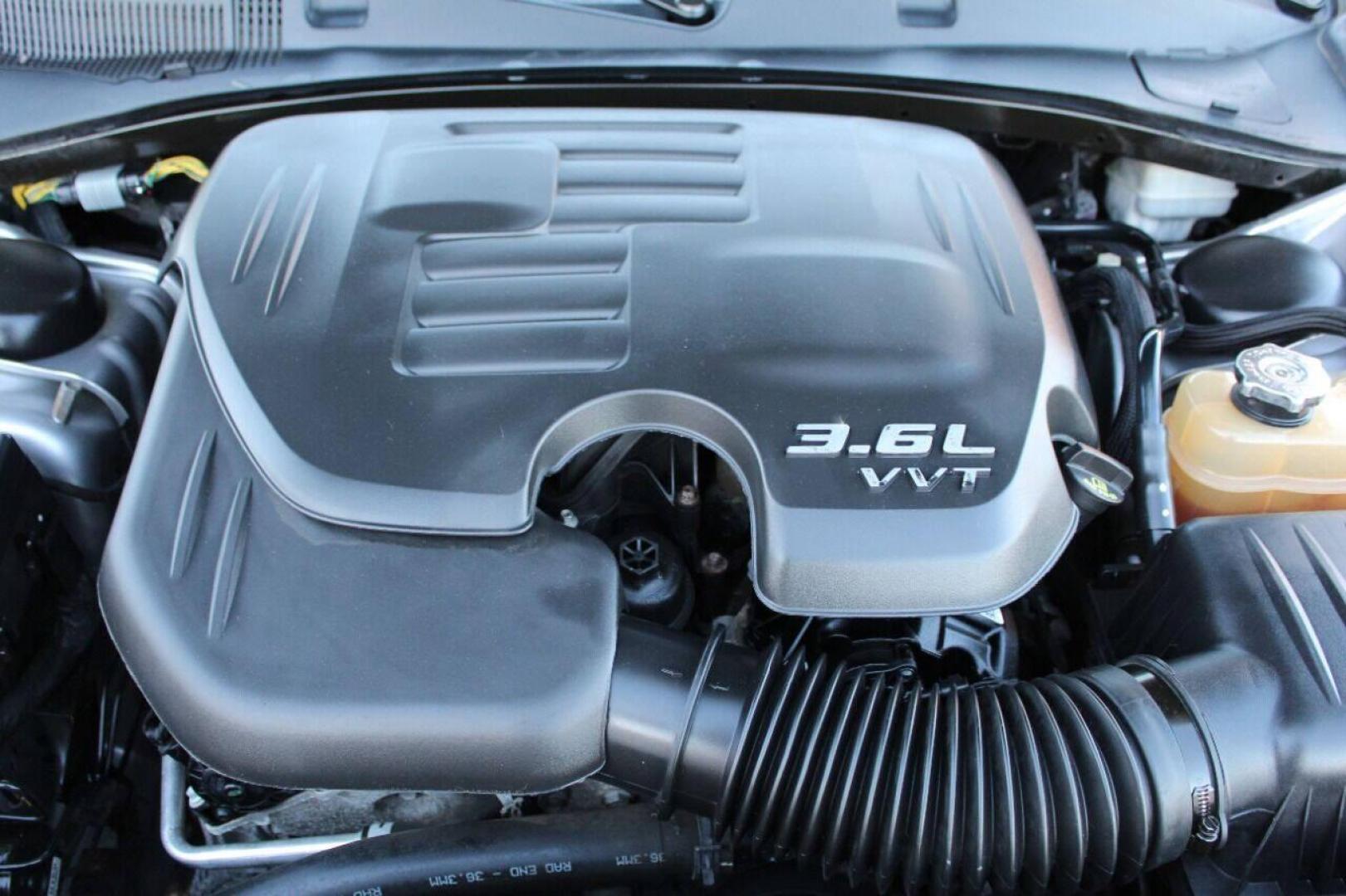 2014 Silver Dodge Charger SE (2C3CDXBG8EH) with an 3.6L V6 DOHC 24V engine, 5-Speed Automatic transmission, located at 4301 NW 39th , Oklahoma City, OK, 73112, (405) 949-5600, 35.512135, -97.598671 - Photo#7