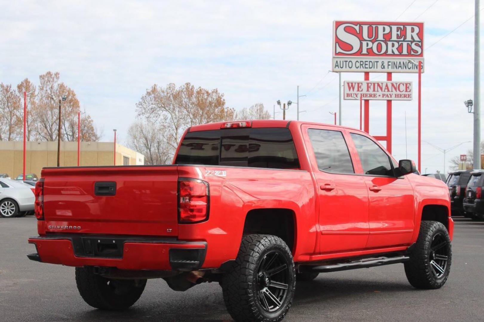 2017 Red Chevrolet Silverado 1500 LT Crew Cab 4WD (3GCUKREC9HG) with an 5.3L V8 OHV 16V engine, 6A transmission, located at 4301 NW 39th , Oklahoma City, OK, 73112, (405) 949-5600, 35.512135, -97.598671 - NO DRIVERS LICENCE NO-FULL COVERAGE INSURANCE-NO CREDIT CHECK. COME ON OVER TO SUPERSPORTS AND TAKE A LOOK AND TEST DRIVE. PLEASE GIVE US A CALL AT (405) 949-5600. NO LICENSIA DE MANEJAR- NO SEGURO DE COBERTURA TOTAL- NO VERIFICACCION DE CREDITO. POR FAVOR VENGAN A SUPERSPORTS, ECHE UN - Photo#4