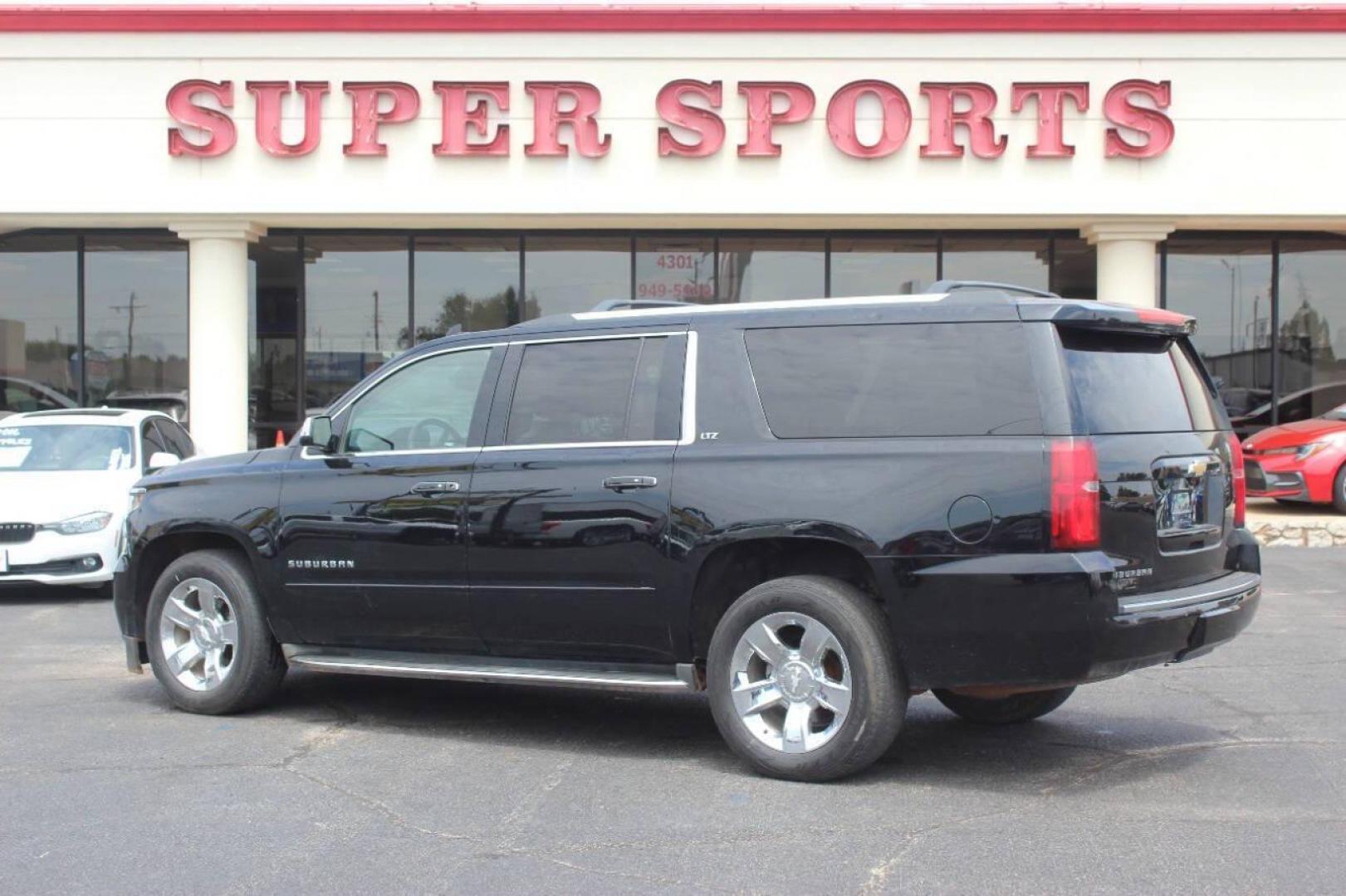 2015 Black Chevrolet Suburban LTZ 1500 4WD (1GNSKKKC3FR) with an 5.3L V8 OHV 16V engine, 6-Speed Automatic transmission, located at 4301 NW 39th , Oklahoma City, OK, 73112, (405) 949-5600, 35.512135, -97.598671 - NO DRIVERS LICENCE NO-FULL COVERAGE INSURANCE-NO CREDIT CHECK. COME ON OVER TO SUPERSPORTS AND TAKE A LOOK AND TEST DRIVE. PLEASE GIVE US A CALL AT (405) 949-5600. NO LICENSIA DE MANEJAR- NO SEGURO DE COBERTURA TOTAL- NO VERIFICACCION DE CREDITO. POR FAVOR VENGAN A SUPERSPORTS, ECHE UN - Photo#5