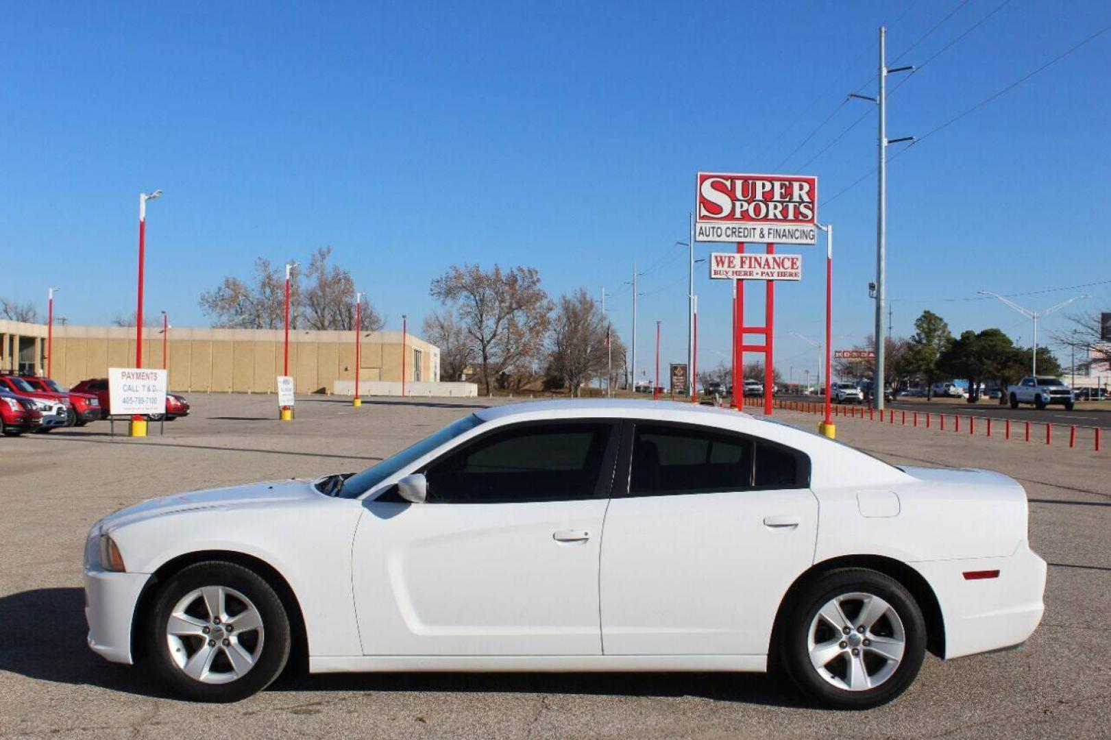 2013 White Dodge Charger SE (2C3CDXBG5DH) with an 3.6L V6 DOHC 24V engine, 5-Speed Automatic transmission, located at 4301 NW 39th , Oklahoma City, OK, 73112, (405) 949-5600, 35.512135, -97.598671 - NO DRIVERS LICENCE NO-FULL COVERAGE INSURANCE-NO CREDIT CHECK. COME ON OVER TO SUPERSPORTS AND TAKE A LOOK AND TEST DRIVE PLEASE GIVE US A CALL AT (405) 949-5600. NO LICENSIA DE MANEJAR- NO SEGURO DE COBERTURA TOTAL- NO VERIFICACCION DE CREDITO. POR FAVOR VENGAN A SUPERSPORTS, ECHE - Photo#6
