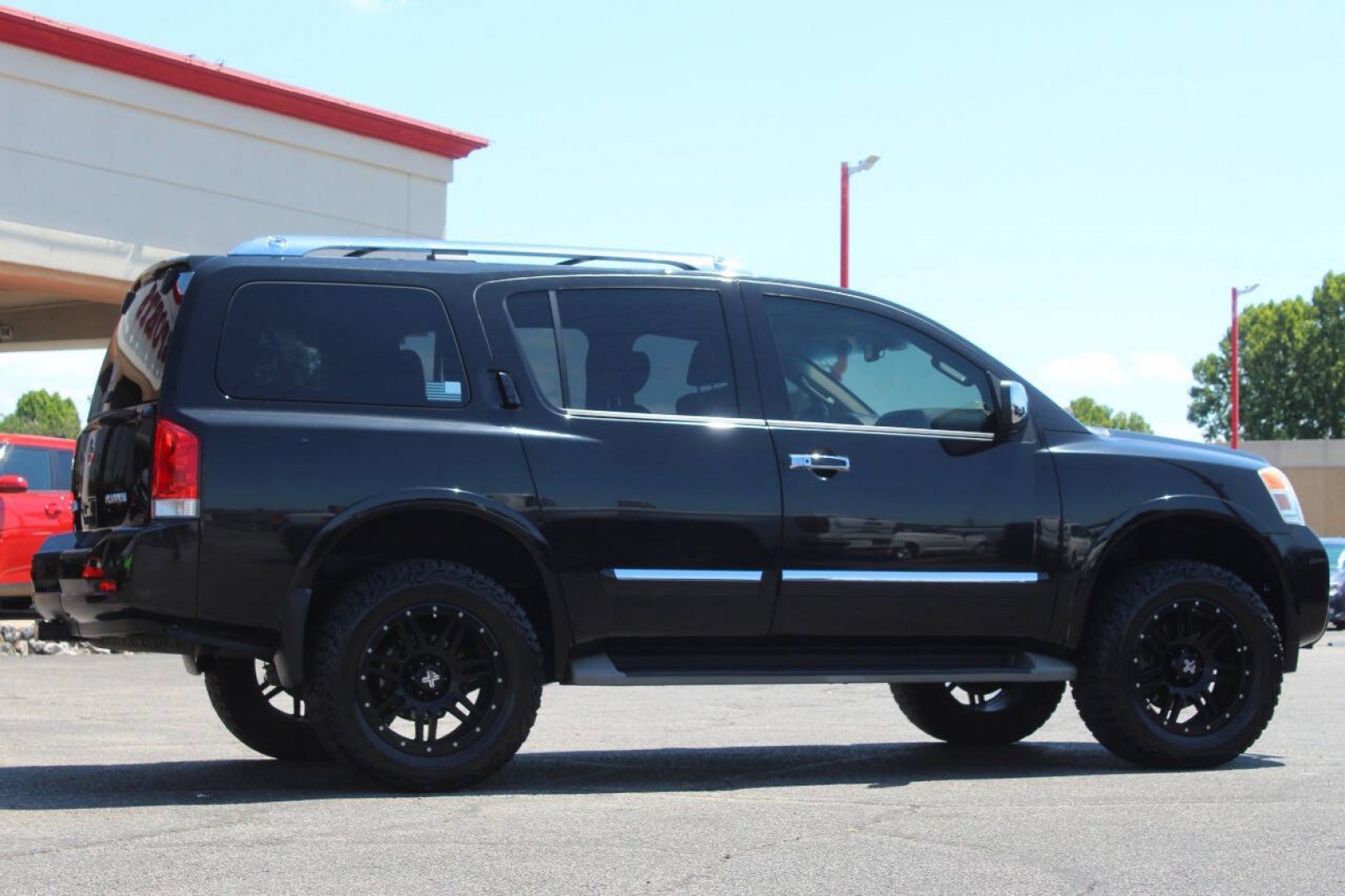 2013 Black Nissan Armada Platinum 4WD (5N1AA0NEXDN) with an 5.6L V8 5.6L V8 engine, Automatic 5-Speed transmission, located at 4301 NW 39th , Oklahoma City, OK, 73112, (405) 949-5600, 35.512135, -97.598671- Photo#3