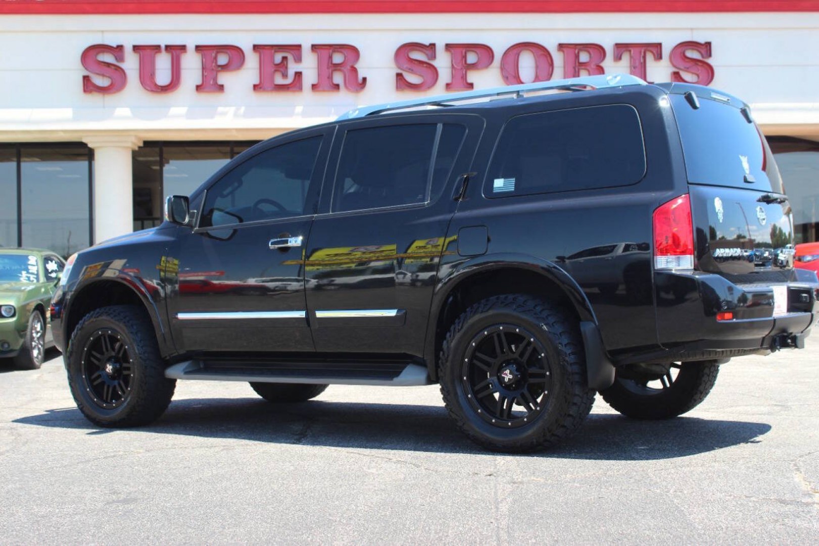 2013 Black Nissan Armada Platinum 4WD (5N1AA0NEXDN) with an 5.6L V8 5.6L V8 engine, Automatic 5-Speed transmission, located at 4301 NW 39th , Oklahoma City, OK, 73112, (405) 949-5600, 35.512135, -97.598671- Photo#4