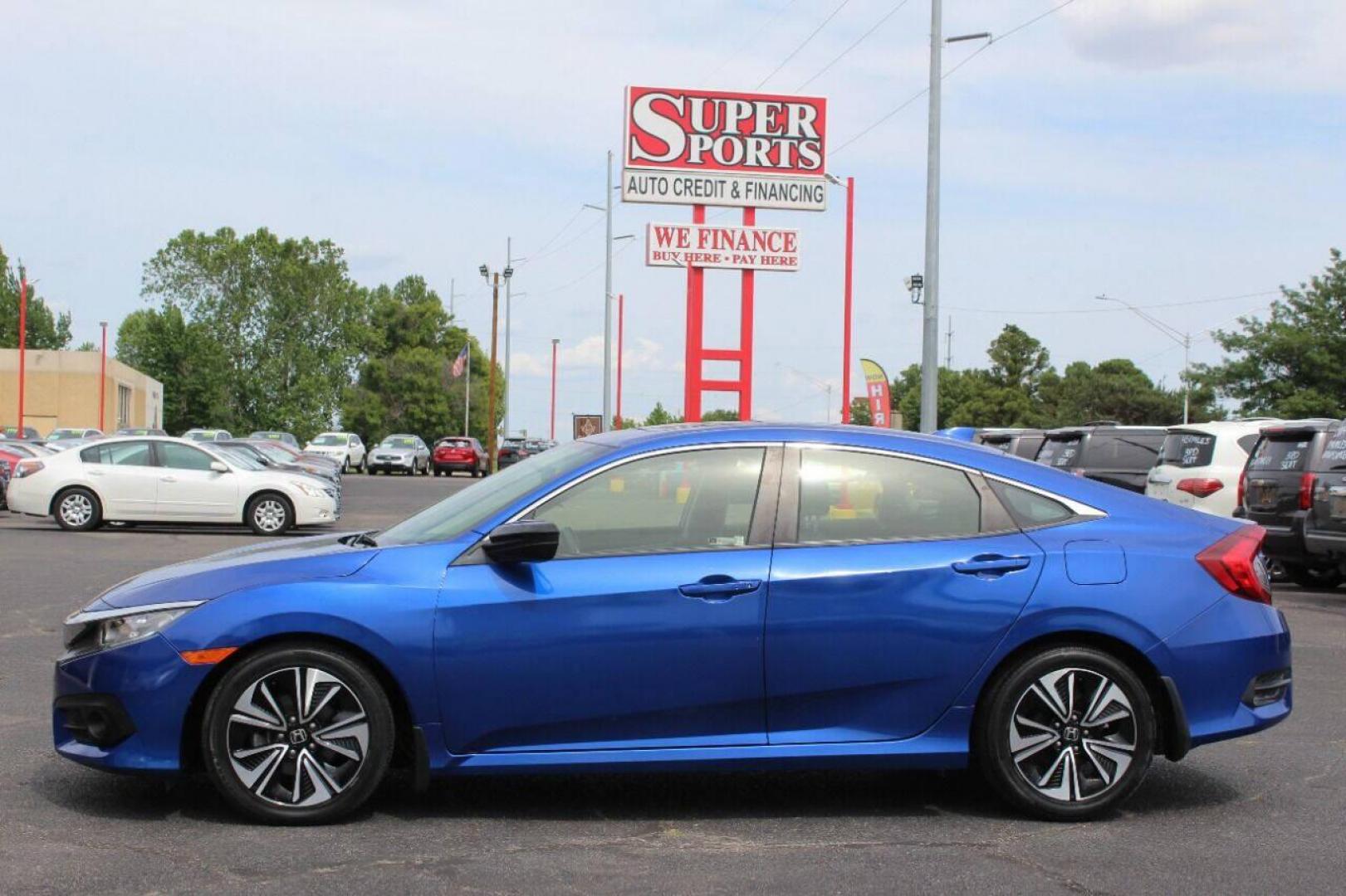 2018 Blue Honda Civic EX-T Sedan CVT (JHMFC1F3XJX) with an 1.5L L4 DOHC 16V TURBO engine, CVT transmission, located at 4301 NW 39th , Oklahoma City, OK, 73112, (405) 949-5600, 35.512135, -97.598671 - NO DRIVERS LICENCE NO-FULL COVERAGE INSURANCE-NO CREDIT CHECK. COME ON OVER TO SUPERSPORTS AND TAKE A LOOK AND TEST DRIVE. PLEASE GIVE US A CALL AT (405) 949-5600. NO LICENSIA DE MANEJAR- NO SEGURO DE COBERTURA TOTAL- NO VERIFICACCION DE CREDITO. POR FAVOR VENGAN A SUPERSPORTS, ECHE UN - Photo#6