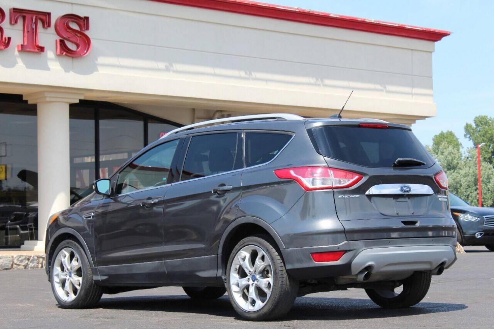 2015 Gray Ford Escape Titanium FWD (1FMCU0J97FU) with an 2.0L L4 DOHC 16V engine, 6-Speed Automatic transmission, located at 4301 NW 39th , Oklahoma City, OK, 73112, (405) 949-5600, 35.512135, -97.598671 - NO DRIVERS LICENCE NO-FULL COVERAGE INSURANCE-NO CREDIT CHECK. COME ON OVER TO SUPERSPORTS AND TAKE A LOOK AND TEST DRIVE PLEASE GIVE US A CALL AT (405) 949-5600. NO LICENSIA DE MANEJAR- NO SEGURO DE COBERTURA TOTAL- NO VERIFICACCION DE CREDITO. POR FAVOR VENGAN A SUPERSPORTS, ECHE UN V - Photo#5