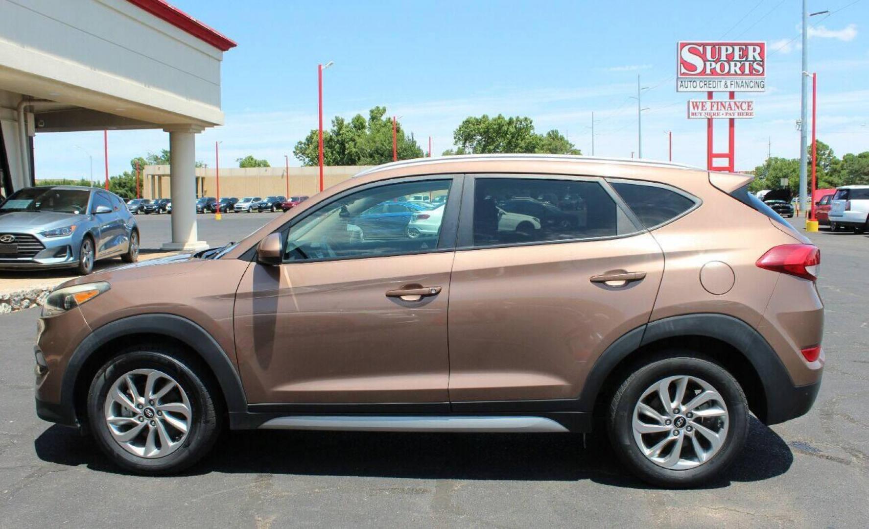 2017 Brown Hyundai Tucson SE w/Preferred Package (KM8J33A44HU) with an 2.0L L4 DOHC 16V engine, 6A transmission, located at 4301 NW 39th , Oklahoma City, OK, 73112, (405) 949-5600, 35.512135, -97.598671 - NO DRIVERS LICENCE NO-FULL COVERAGE INSURANCE-NO CREDIT CHECK. COME ON OVER TO SUPERSPORTS AND TAKE A LOOK AND TEST DRIVE. PLEASE GIVE US A CALL AT (405) 949-5600. NO LICENSIA DE MANEJAR- NO SEGURO DE COBERTURA TOTAL- NO VERIFICACCION DE CREDITO. POR FAVOR VENGAN A SUPERSPORTS, ECHE UN - Photo#18