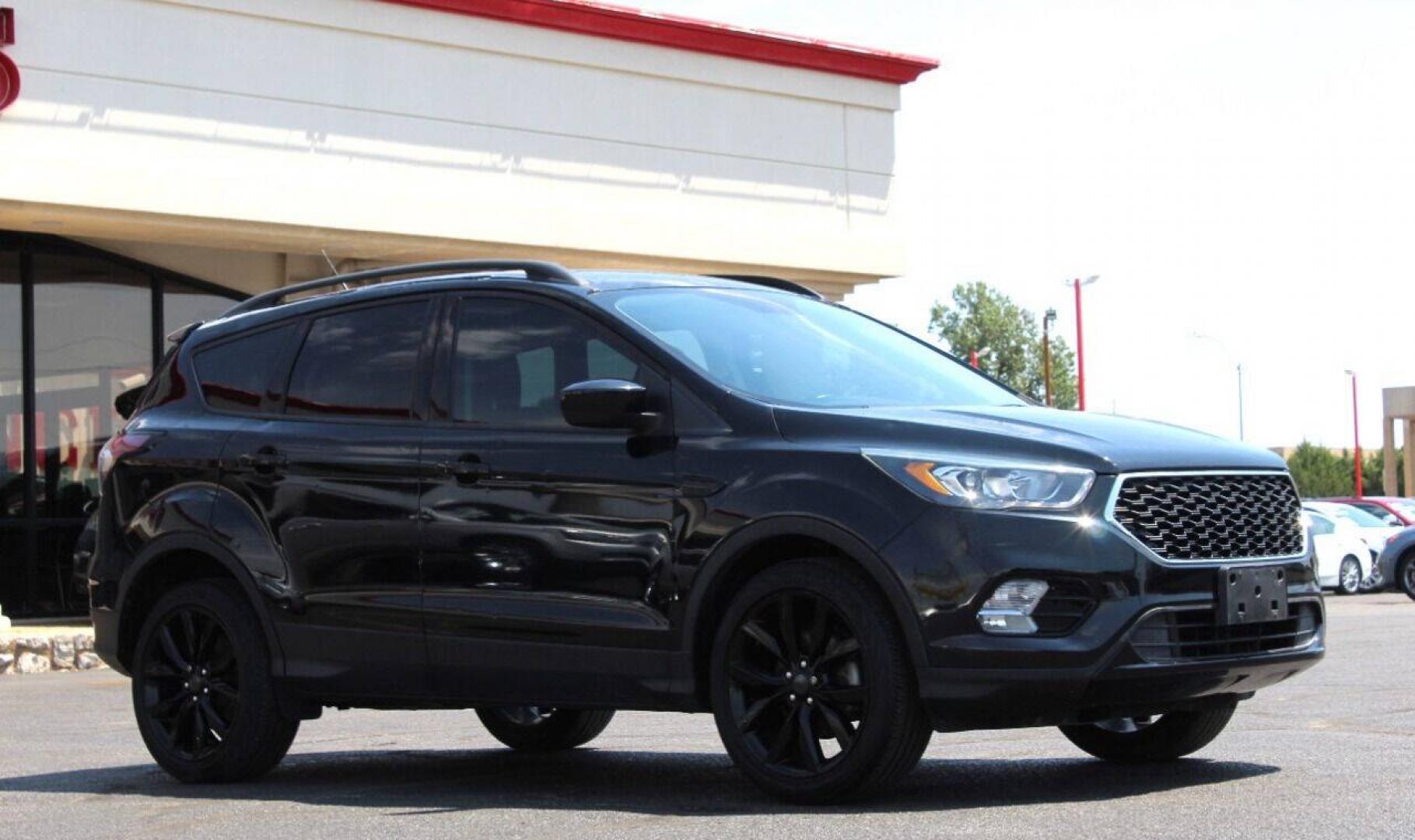 2018 Black Ford Escape SE FWD (1FMCU0GD5JU) with an 1.5L I4 Turbocharger 1.5L I4 engine, Automatic 6-Speed transmission, located at 4301 NW 39th , Oklahoma City, OK, 73112, (405) 949-5600, 35.512135, -97.598671 - NO DRIVERS LICENCE NO - FULL COVERAGE INSURANCE - NO CREDIT CHECK. COME ON OVER TO SUPERSPORTS AND TAKE A LOOK AND TEST DRIVE. PLEASE GIVE US A CALL AT (405) 949-5600. NO LICENCIA DE MANEJAR - NO SEGURO DE COBERTURA TOTAL- NO VERIFICACION DE CREDITO. POR FAVOR VENGAN A SUPERSPORTS, E- Photo#2