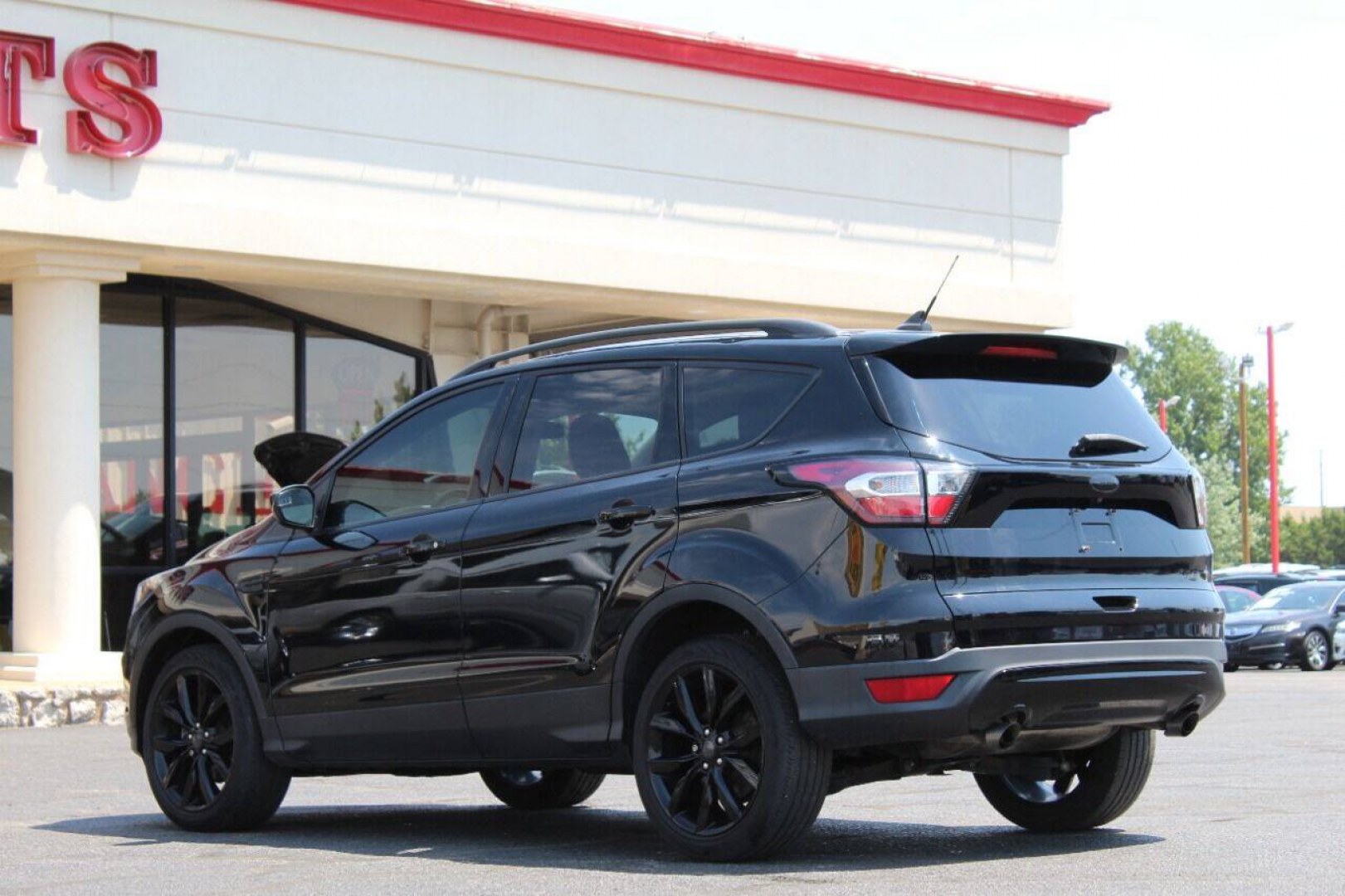 2018 Black Ford Escape SE FWD (1FMCU0GD5JU) with an 1.5L I4 Turbocharger 1.5L I4 engine, Automatic 6-Speed transmission, located at 4301 NW 39th , Oklahoma City, OK, 73112, (405) 949-5600, 35.512135, -97.598671 - NO DRIVERS LICENCE NO - FULL COVERAGE INSURANCE - NO CREDIT CHECK. COME ON OVER TO SUPERSPORTS AND TAKE A LOOK AND TEST DRIVE. PLEASE GIVE US A CALL AT (405) 949-5600. NO LICENCIA DE MANEJAR - NO SEGURO DE COBERTURA TOTAL- NO VERIFICACION DE CREDITO. POR FAVOR VENGAN A SUPERSPORTS, E- Photo#5