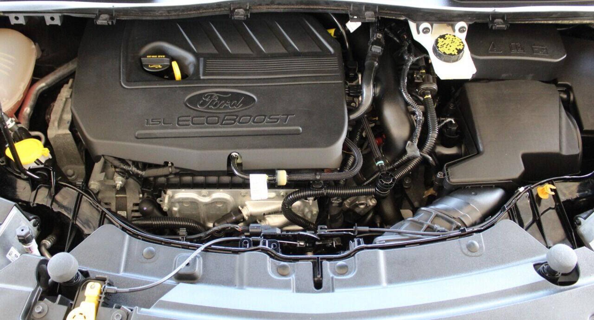 2018 Black Ford Escape SE FWD (1FMCU0GD5JU) with an 1.5L I4 Turbocharger 1.5L I4 engine, Automatic 6-Speed transmission, located at 4301 NW 39th , Oklahoma City, OK, 73112, (405) 949-5600, 35.512135, -97.598671 - NO DRIVERS LICENCE NO - FULL COVERAGE INSURANCE - NO CREDIT CHECK. COME ON OVER TO SUPERSPORTS AND TAKE A LOOK AND TEST DRIVE. PLEASE GIVE US A CALL AT (405) 949-5600. NO LICENCIA DE MANEJAR - NO SEGURO DE COBERTURA TOTAL- NO VERIFICACION DE CREDITO. POR FAVOR VENGAN A SUPERSPORTS, E- Photo#7