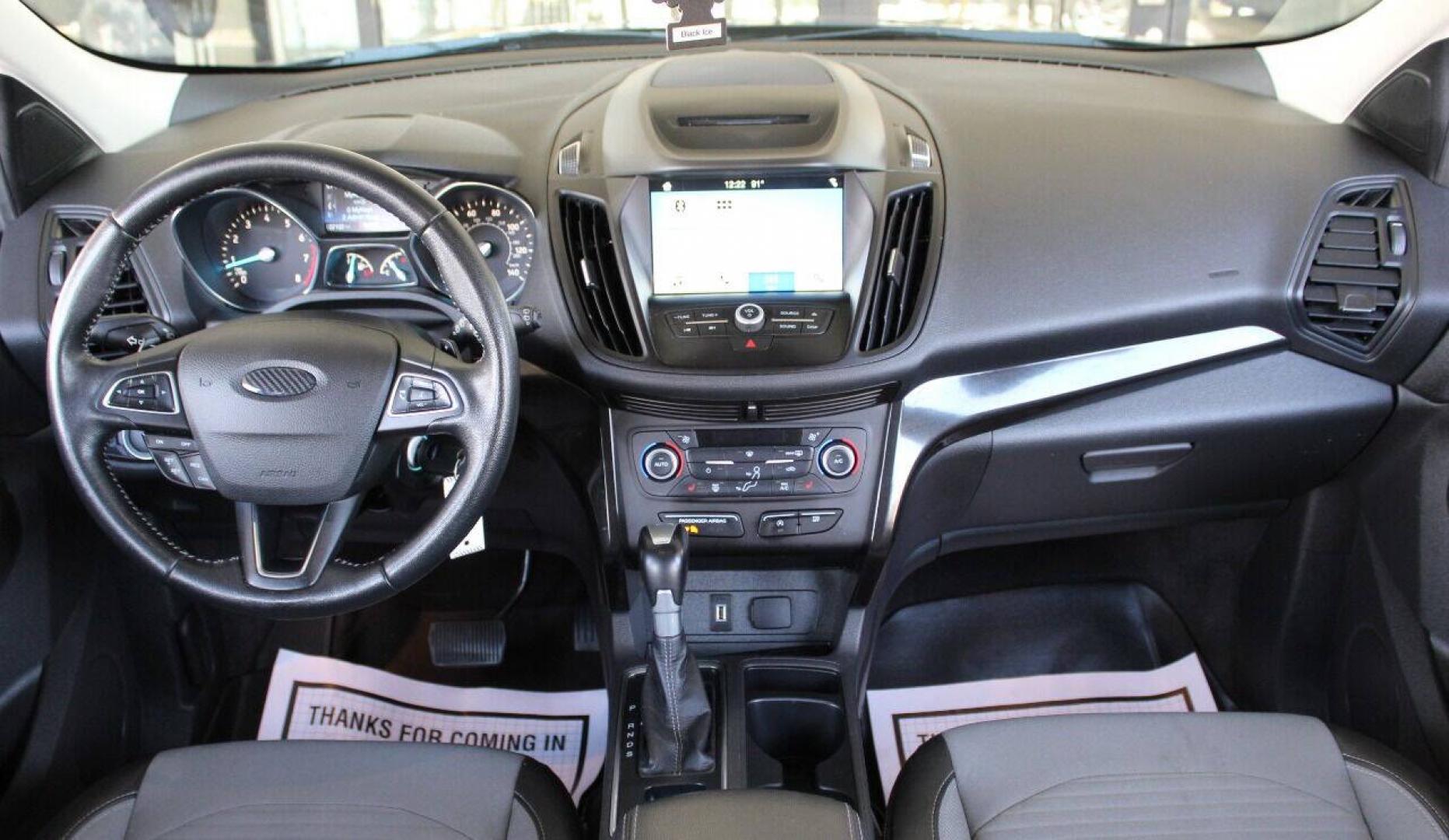 2018 Black Ford Escape SE FWD (1FMCU0GD5JU) with an 1.5L I4 Turbocharger 1.5L I4 engine, Automatic 6-Speed transmission, located at 4301 NW 39th , Oklahoma City, OK, 73112, (405) 949-5600, 35.512135, -97.598671 - NO DRIVERS LICENCE NO - FULL COVERAGE INSURANCE - NO CREDIT CHECK. COME ON OVER TO SUPERSPORTS AND TAKE A LOOK AND TEST DRIVE. PLEASE GIVE US A CALL AT (405) 949-5600. NO LICENCIA DE MANEJAR - NO SEGURO DE COBERTURA TOTAL- NO VERIFICACION DE CREDITO. POR FAVOR VENGAN A SUPERSPORTS, E- Photo#17