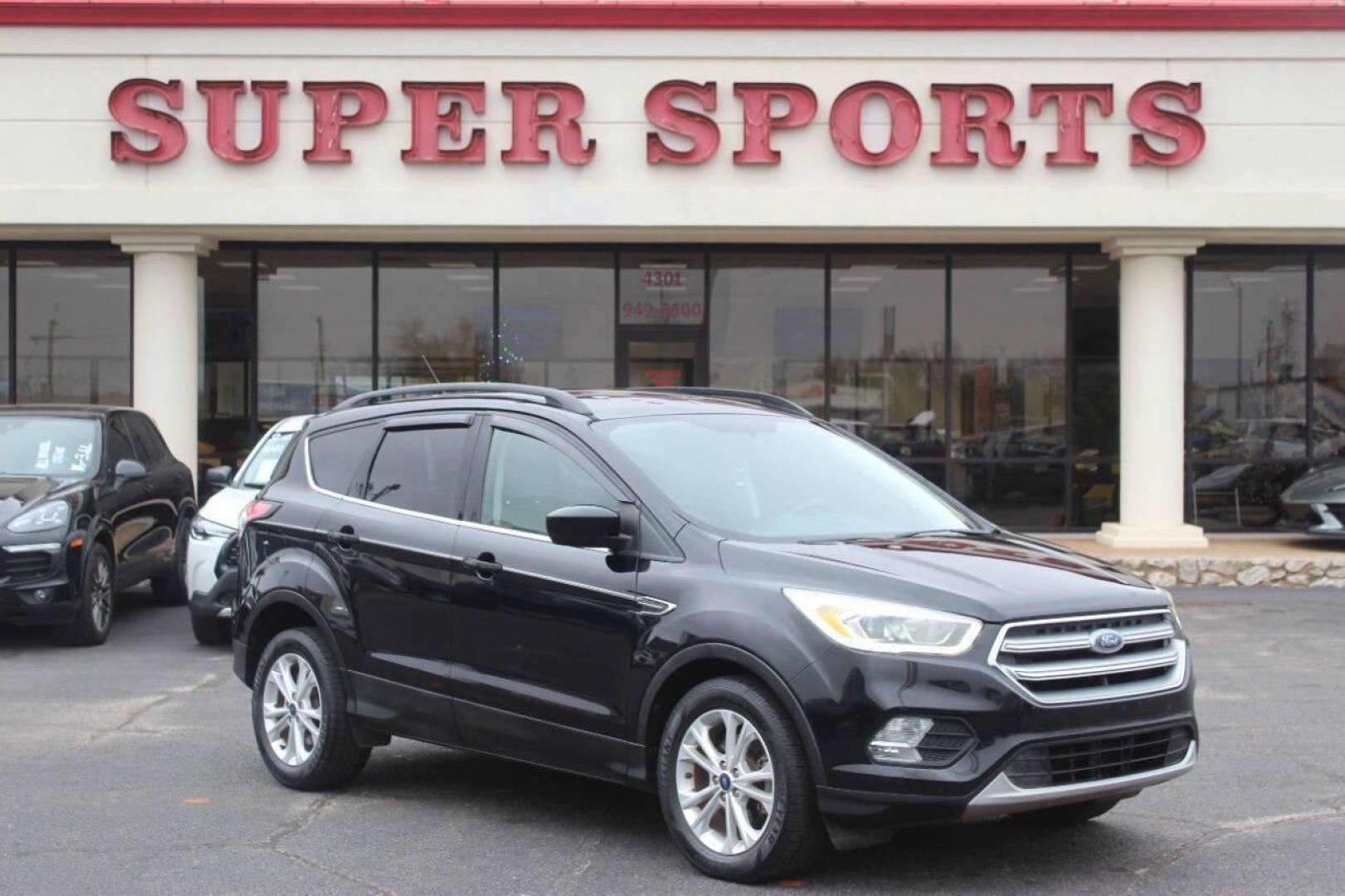 2017 Black Ford Escape SE FWD (1FMCU0GD4HU) with an 1.5L L4 DOHC 16V engine, 6A transmission, located at 4301 NW 39th , Oklahoma City, OK, 73112, (405) 949-5600, 35.512135, -97.598671 - NO DRIVERS LICENCE NO-FULL COVERAGE INSURANCE-NO CREDIT CHECK. COME ON OVER TO SUPERSPORTS AND TAKE A LOOK AND TEST DRIVE. PLEASE GIVE US A CALL AT (405) 949-5600. NO LICENSIA DE MANEJAR- NO SEGURO DE COBERTURA TOTAL- NO VERIFICACCION DE CREDITO. POR FAVOR VENGAN A SUPERSPORTS, - Photo#0