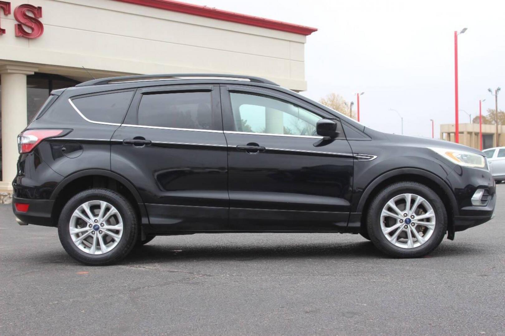2017 Black Ford Escape SE FWD (1FMCU0GD4HU) with an 1.5L L4 DOHC 16V engine, 6A transmission, located at 4301 NW 39th , Oklahoma City, OK, 73112, (405) 949-5600, 35.512135, -97.598671 - NO DRIVERS LICENCE NO-FULL COVERAGE INSURANCE-NO CREDIT CHECK. COME ON OVER TO SUPERSPORTS AND TAKE A LOOK AND TEST DRIVE. PLEASE GIVE US A CALL AT (405) 949-5600. NO LICENSIA DE MANEJAR- NO SEGURO DE COBERTURA TOTAL- NO VERIFICACCION DE CREDITO. POR FAVOR VENGAN A SUPERSPORTS, - Photo#2