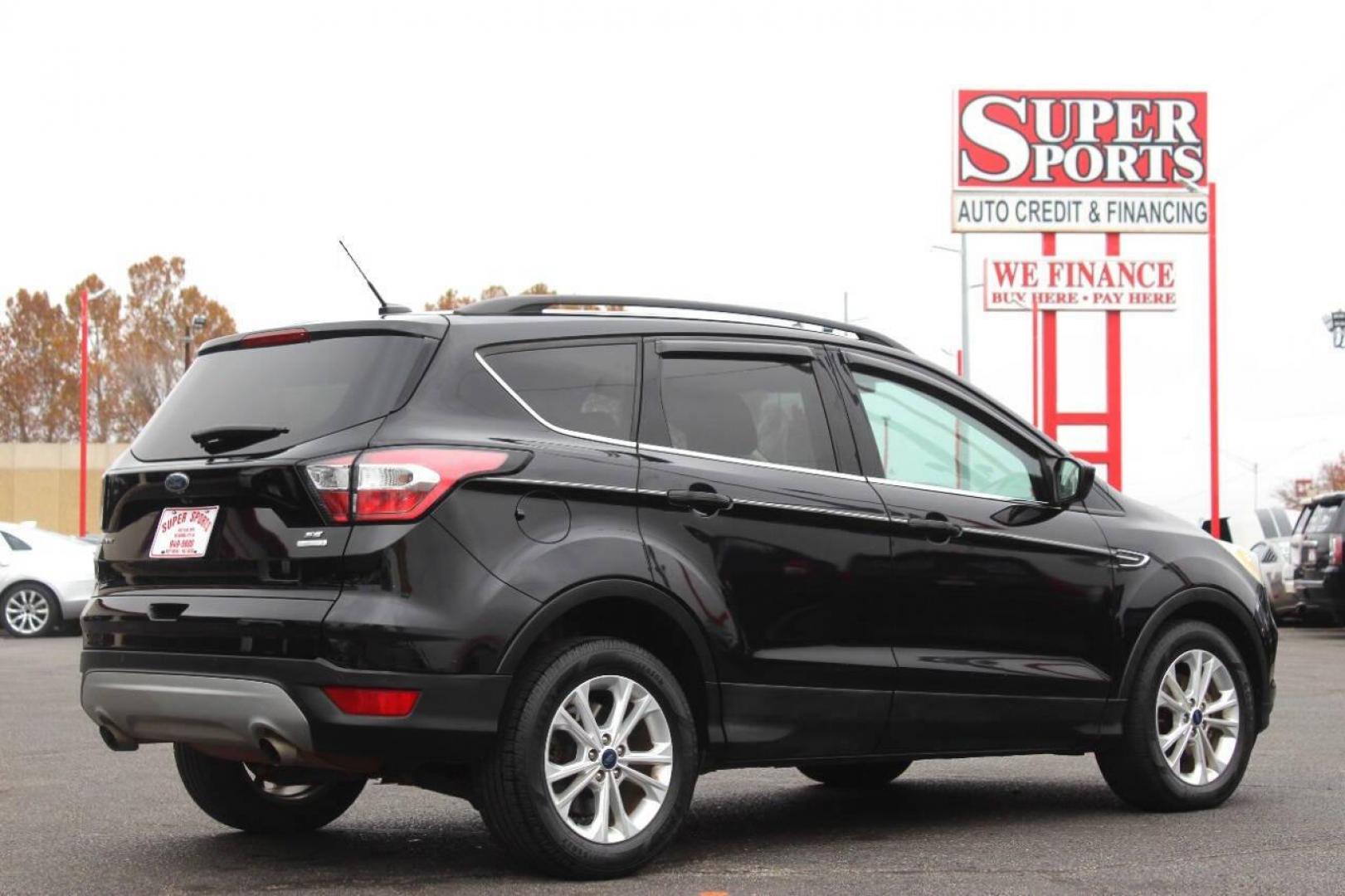 2017 Black Ford Escape SE FWD (1FMCU0GD4HU) with an 1.5L L4 DOHC 16V engine, 6A transmission, located at 4301 NW 39th , Oklahoma City, OK, 73112, (405) 949-5600, 35.512135, -97.598671 - NO DRIVERS LICENCE NO-FULL COVERAGE INSURANCE-NO CREDIT CHECK. COME ON OVER TO SUPERSPORTS AND TAKE A LOOK AND TEST DRIVE. PLEASE GIVE US A CALL AT (405) 949-5600. NO LICENSIA DE MANEJAR- NO SEGURO DE COBERTURA TOTAL- NO VERIFICACCION DE CREDITO. POR FAVOR VENGAN A SUPERSPORTS, - Photo#3