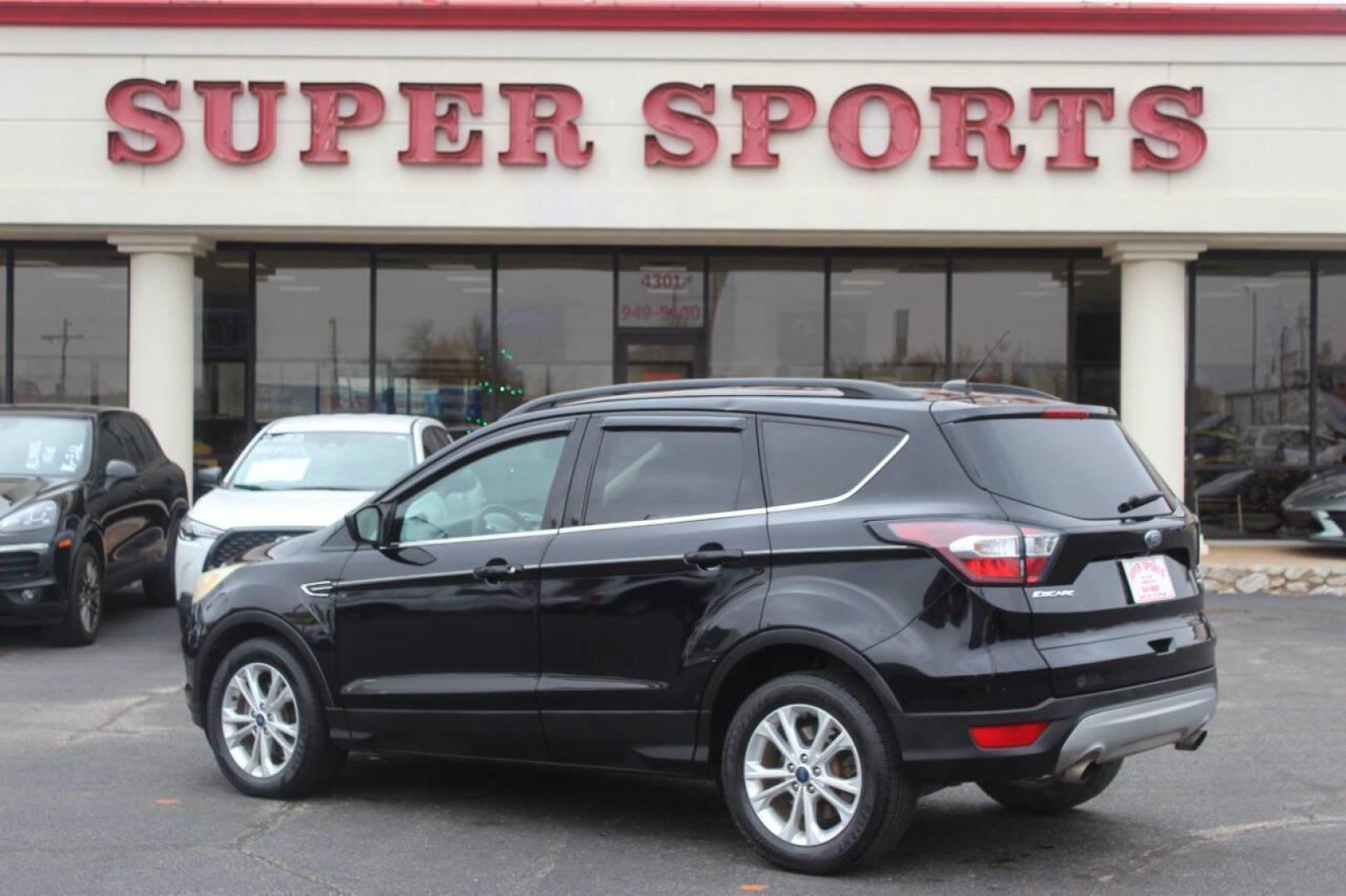 2017 Black Ford Escape SE FWD (1FMCU0GD4HU) with an 1.5L L4 DOHC 16V engine, 6A transmission, located at 4301 NW 39th , Oklahoma City, OK, 73112, (405) 949-5600, 35.512135, -97.598671 - NO DRIVERS LICENCE NO-FULL COVERAGE INSURANCE-NO CREDIT CHECK. COME ON OVER TO SUPERSPORTS AND TAKE A LOOK AND TEST DRIVE. PLEASE GIVE US A CALL AT (405) 949-5600. NO LICENSIA DE MANEJAR- NO SEGURO DE COBERTURA TOTAL- NO VERIFICACCION DE CREDITO. POR FAVOR VENGAN A SUPERSPORTS, - Photo#4
