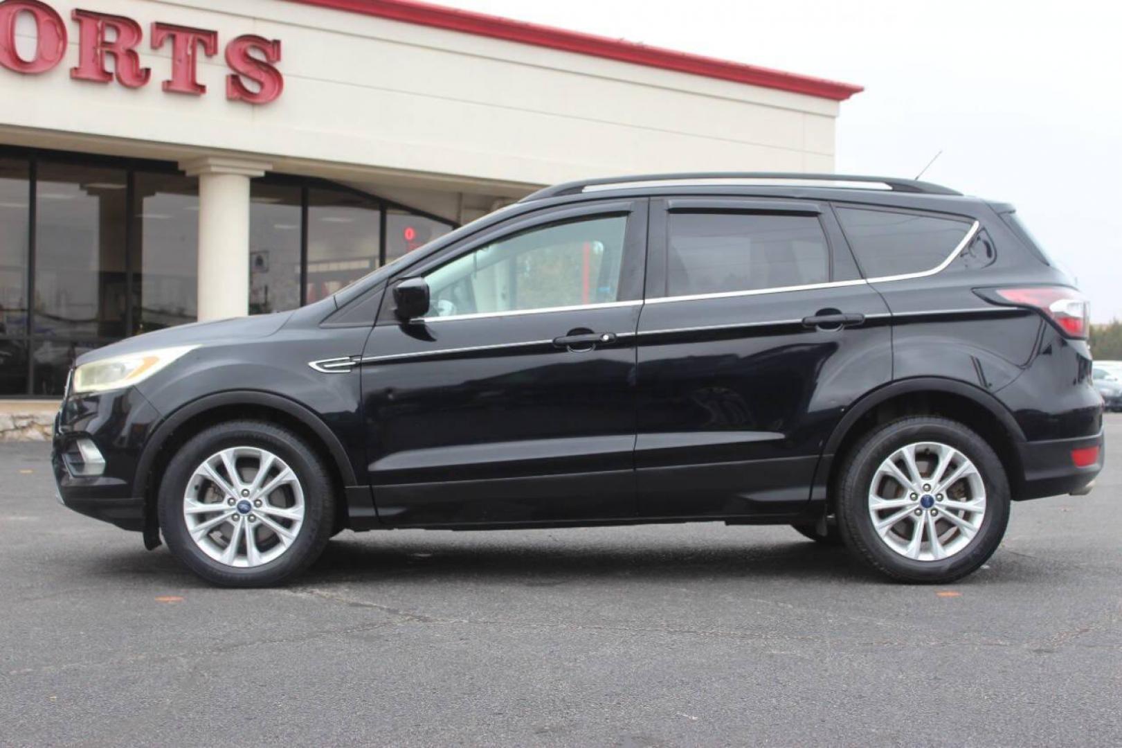 2017 Black Ford Escape SE FWD (1FMCU0GD4HU) with an 1.5L L4 DOHC 16V engine, 6A transmission, located at 4301 NW 39th , Oklahoma City, OK, 73112, (405) 949-5600, 35.512135, -97.598671 - NO DRIVERS LICENCE NO-FULL COVERAGE INSURANCE-NO CREDIT CHECK. COME ON OVER TO SUPERSPORTS AND TAKE A LOOK AND TEST DRIVE. PLEASE GIVE US A CALL AT (405) 949-5600. NO LICENSIA DE MANEJAR- NO SEGURO DE COBERTURA TOTAL- NO VERIFICACCION DE CREDITO. POR FAVOR VENGAN A SUPERSPORTS, - Photo#5