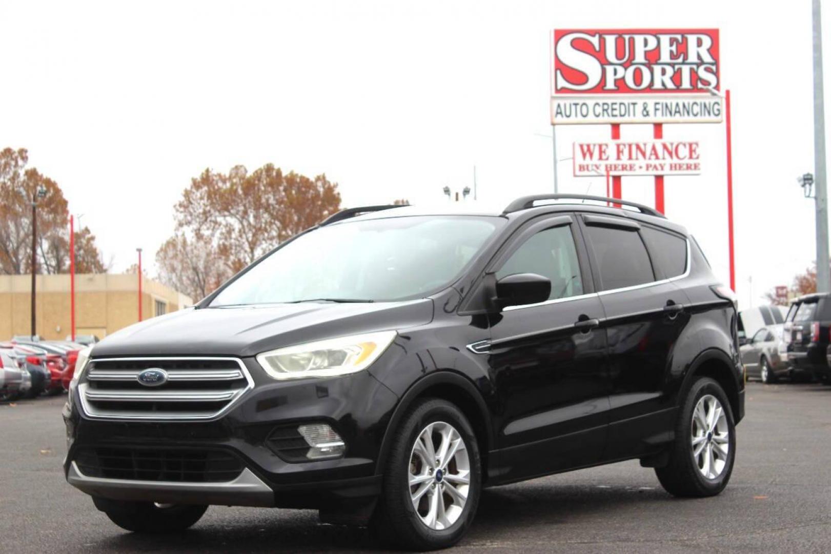 2017 Black Ford Escape SE FWD (1FMCU0GD4HU) with an 1.5L L4 DOHC 16V engine, 6A transmission, located at 4301 NW 39th , Oklahoma City, OK, 73112, (405) 949-5600, 35.512135, -97.598671 - NO DRIVERS LICENCE NO-FULL COVERAGE INSURANCE-NO CREDIT CHECK. COME ON OVER TO SUPERSPORTS AND TAKE A LOOK AND TEST DRIVE. PLEASE GIVE US A CALL AT (405) 949-5600. NO LICENSIA DE MANEJAR- NO SEGURO DE COBERTURA TOTAL- NO VERIFICACCION DE CREDITO. POR FAVOR VENGAN A SUPERSPORTS, - Photo#6