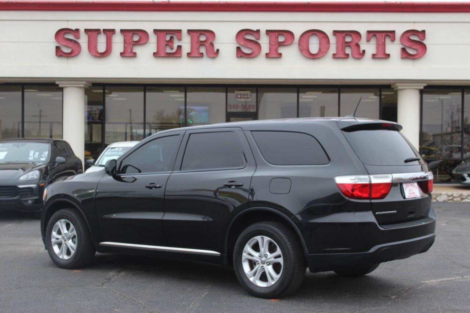 2013 Black Dodge Durango SXT RWD (1C4RDHAG7DC) with an 3.6L V6 DOHC 24V engine, 5-Speed Automatic transmission, located at 4301 NW 39th , Oklahoma City, OK, 73112, (405) 949-5600, 35.512135, -97.598671 - NO DRIVERS LICENCE NO-FULL COVERAGE INSURANCE-NO CREDIT CHECK. COME ON OVER TO SUPERSPORTS AND TAKE A LOOK AND TEST DRIVE PLEASE GIVE US A CALL AT (405) 949-5600. NO LICENSIA DE MANEJAR- NO SEGURO DE COBERTURA TOTAL- NO VERIFICACCION DE CREDITO. POR FAVOR VENGAN A SUPERSPORTS, E - Photo#3