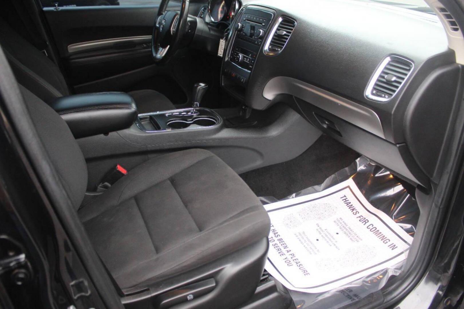 2013 Black Dodge Durango SXT RWD (1C4RDHAG7DC) with an 3.6L V6 DOHC 24V engine, 5-Speed Automatic transmission, located at 4301 NW 39th , Oklahoma City, OK, 73112, (405) 949-5600, 35.512135, -97.598671 - NO DRIVERS LICENCE NO-FULL COVERAGE INSURANCE-NO CREDIT CHECK. COME ON OVER TO SUPERSPORTS AND TAKE A LOOK AND TEST DRIVE PLEASE GIVE US A CALL AT (405) 949-5600. NO LICENSIA DE MANEJAR- NO SEGURO DE COBERTURA TOTAL- NO VERIFICACCION DE CREDITO. POR FAVOR VENGAN A SUPERSPORTS, E - Photo#6