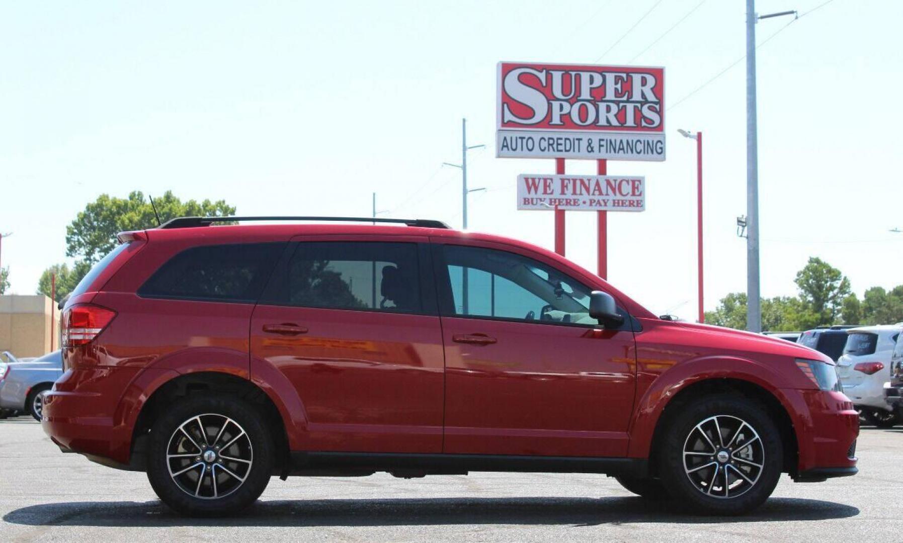 2018 Red Dodge Journey SE (3C4PDCAB3JT) with an 2.4L L4 DOHC 16V engine, 4A transmission, located at 4301 NW 39th , Oklahoma City, OK, 73112, (405) 949-5600, 35.512135, -97.598671 - NO DRIVERS LICENCE NO-FULL COVERAGE INSURANCE-NO CREDIT CHECK. COME ON OVER TO SUPERSPORTS AND TAKE A LOOK AND TEST DRIVE. PLEASE GIVE US A CALL AT (405) 949-5600. NO LICENSIA DE MANEJAR - NO SEGURO DE COBERTURA TOTAL - NO VERIFICACION DE CREDITO. POR FAVOR VENGAN A SUPERSPORTS, ECHE UN - Photo#4