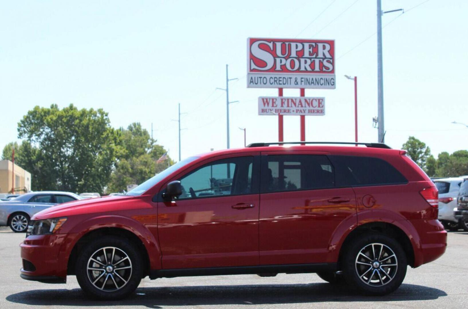 2018 Red Dodge Journey SE (3C4PDCAB3JT) with an 2.4L L4 DOHC 16V engine, 4A transmission, located at 4301 NW 39th , Oklahoma City, OK, 73112, (405) 949-5600, 35.512135, -97.598671 - NO DRIVERS LICENCE NO-FULL COVERAGE INSURANCE-NO CREDIT CHECK. COME ON OVER TO SUPERSPORTS AND TAKE A LOOK AND TEST DRIVE. PLEASE GIVE US A CALL AT (405) 949-5600. NO LICENSIA DE MANEJAR - NO SEGURO DE COBERTURA TOTAL - NO VERIFICACION DE CREDITO. POR FAVOR VENGAN A SUPERSPORTS, ECHE UN - Photo#7
