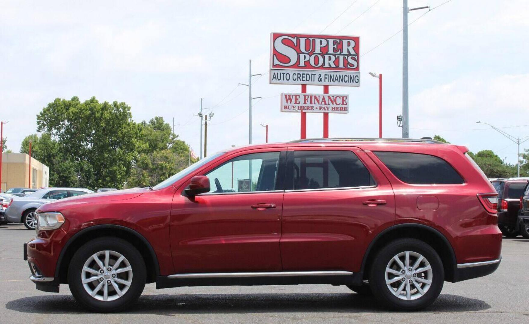 2014 Burgundy Dodge Durango SXT AWD (1C4RDJAG2EC) with an 3.6L V6 DOHC 24V engine, 8-Speed Automatic transmission, located at 4301 NW 39th , Oklahoma City, OK, 73112, (405) 949-5600, 35.512135, -97.598671 - Photo#7