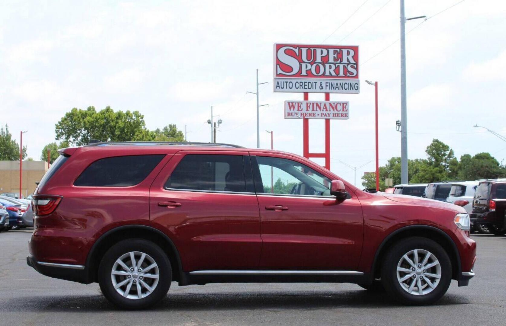 2014 Burgundy Dodge Durango SXT AWD (1C4RDJAG2EC) with an 3.6L V6 DOHC 24V engine, 8-Speed Automatic transmission, located at 4301 NW 39th , Oklahoma City, OK, 73112, (405) 949-5600, 35.512135, -97.598671 - Photo#4