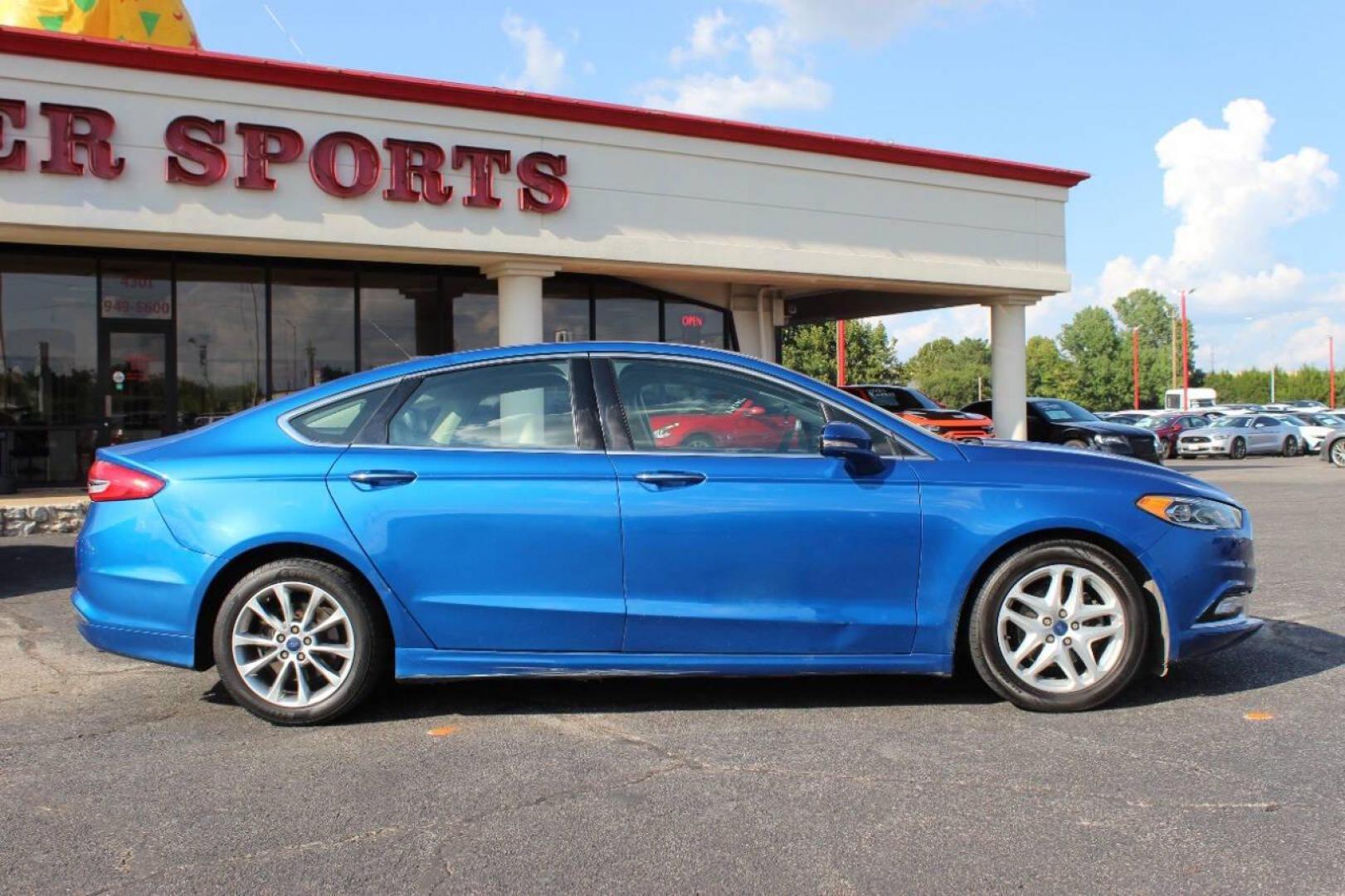 2017 Blue Ford Fusion SE (3FA6P0HD3HR) with an 1.5L L4 DOHC 16V engine, 6A transmission, located at 4301 NW 39th , Oklahoma City, OK, 73112, (405) 949-5600, 35.512135, -97.598671 - NO DRIVERS LICENCE -NO FULL COVERAGE INSURANCE - NO CREDIT CHECK. COME ON OVER TO SUPERSPORTS, TAKE A LOOK AND TEST DRIVE. PLEASE GIVE US A CALL AT (405) 949-5600. NO LICENCIA DE CONDUCIR - NO SEGURO DE COBERTURA TOTAL - NO VERIFICACION DE CREDITO. VISITENOS EN SUPERSPORTS, MIRE NUESTRO - Photo#2