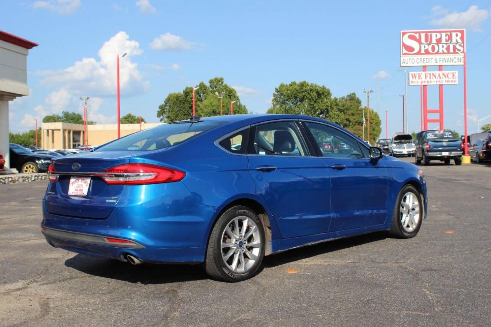 2017 Blue Ford Fusion SE (3FA6P0HD3HR) with an 1.5L L4 DOHC 16V engine, 6A transmission, located at 4301 NW 39th , Oklahoma City, OK, 73112, (405) 949-5600, 35.512135, -97.598671 - NO DRIVERS LICENCE -NO FULL COVERAGE INSURANCE - NO CREDIT CHECK. COME ON OVER TO SUPERSPORTS, TAKE A LOOK AND TEST DRIVE. PLEASE GIVE US A CALL AT (405) 949-5600. NO LICENCIA DE CONDUCIR - NO SEGURO DE COBERTURA TOTAL - NO VERIFICACION DE CREDITO. VISITENOS EN SUPERSPORTS, MIRE NUESTRO - Photo#3