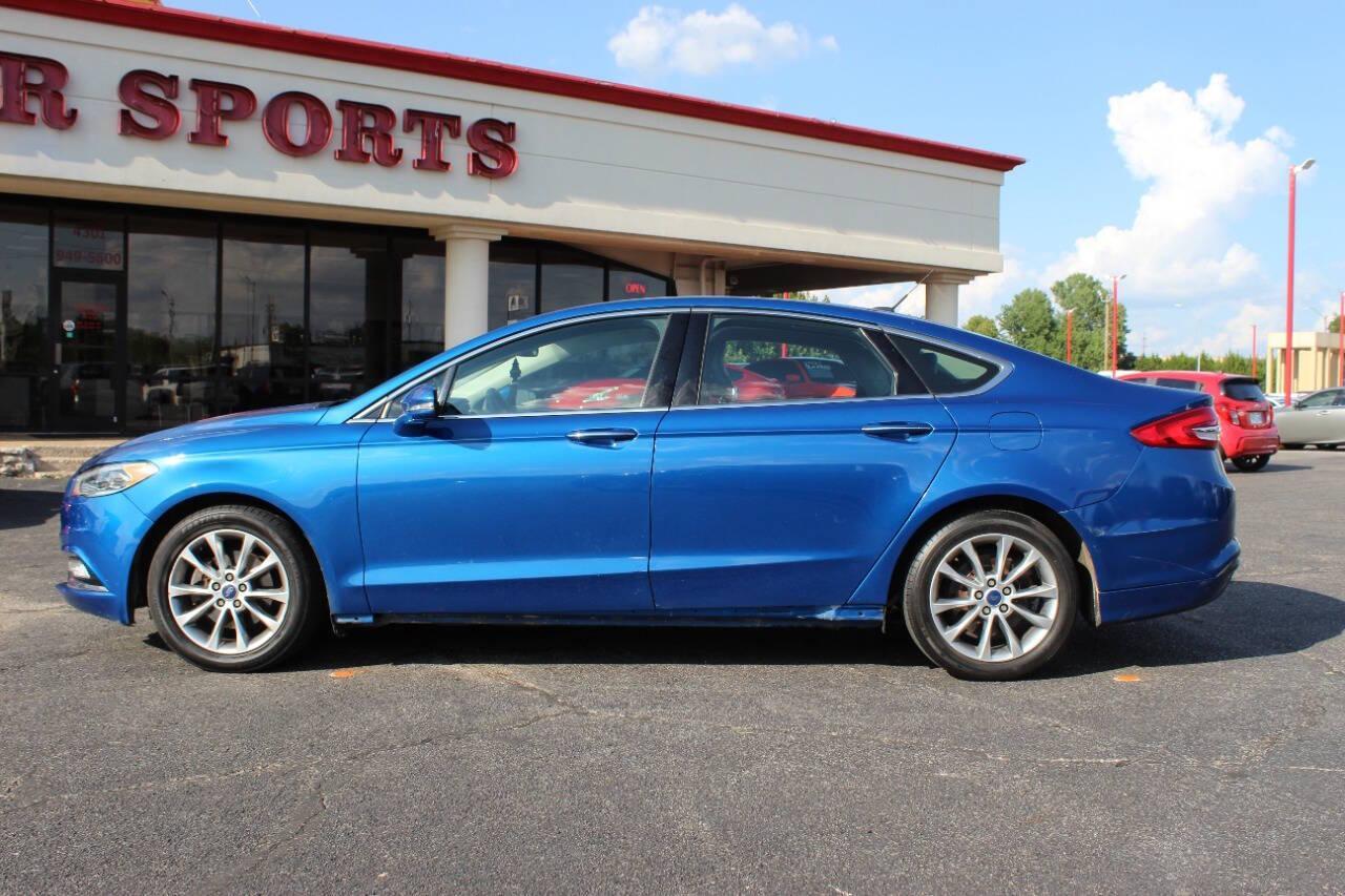 2017 Blue Ford Fusion SE (3FA6P0HD3HR) with an 1.5L L4 DOHC 16V engine, 6A transmission, located at 4301 NW 39th , Oklahoma City, OK, 73112, (405) 949-5600, 35.512135, -97.598671 - NO DRIVERS LICENCE -NO FULL COVERAGE INSURANCE - NO CREDIT CHECK. COME ON OVER TO SUPERSPORTS, TAKE A LOOK AND TEST DRIVE. PLEASE GIVE US A CALL AT (405) 949-5600. NO LICENCIA DE CONDUCIR - NO SEGURO DE COBERTURA TOTAL - NO VERIFICACION DE CREDITO. VISITENOS EN SUPERSPORTS, MIRE NUESTRO - Photo#5
