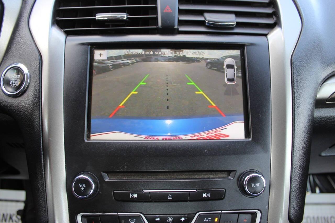 2017 Blue Ford Fusion SE (3FA6P0HD3HR) with an 1.5L L4 DOHC 16V engine, 6A transmission, located at 4301 NW 39th , Oklahoma City, OK, 73112, (405) 949-5600, 35.512135, -97.598671 - NO DRIVERS LICENCE -NO FULL COVERAGE INSURANCE - NO CREDIT CHECK. COME ON OVER TO SUPERSPORTS, TAKE A LOOK AND TEST DRIVE. PLEASE GIVE US A CALL AT (405) 949-5600. NO LICENCIA DE CONDUCIR - NO SEGURO DE COBERTURA TOTAL - NO VERIFICACION DE CREDITO. VISITENOS EN SUPERSPORTS, MIRE NUESTRO - Photo#18