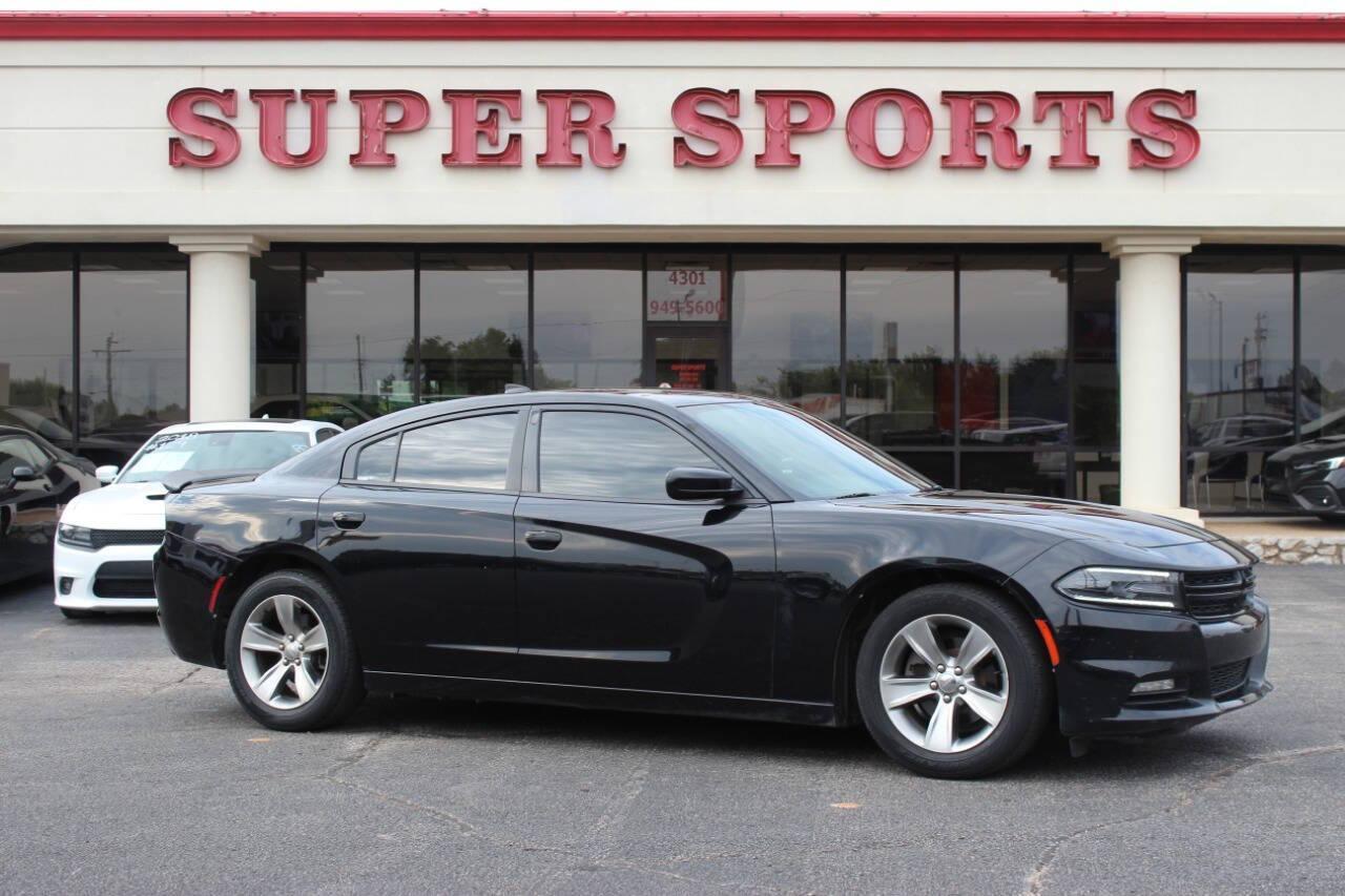 2018 Black Dodge Charger SXT (2C3CDXHG3JH) with an 3.6L V6 DOHC 24V engine, 8A transmission, located at 4301 NW 39th , Oklahoma City, OK, 73112, (405) 949-5600, 35.512135, -97.598671 - NO DRIVERS LICENCE NO-FULL COVERAGE INSURANCE-NO CREDIT CHECK. COME ON OVER TO SUPERSPORTS AND TAKE A LOOK AND TEST DRIVE. PLEASE GIVE US A CALL AT (405) 949-5600. NO LICENSIA DE MANEJAR- NO SEGURO DE COBERTURA TOTAL- NO VERIFICACCION DE CREDITO. POR FAVOR VENGAN A SUPERSPORTS, ECHE UN - Photo#0