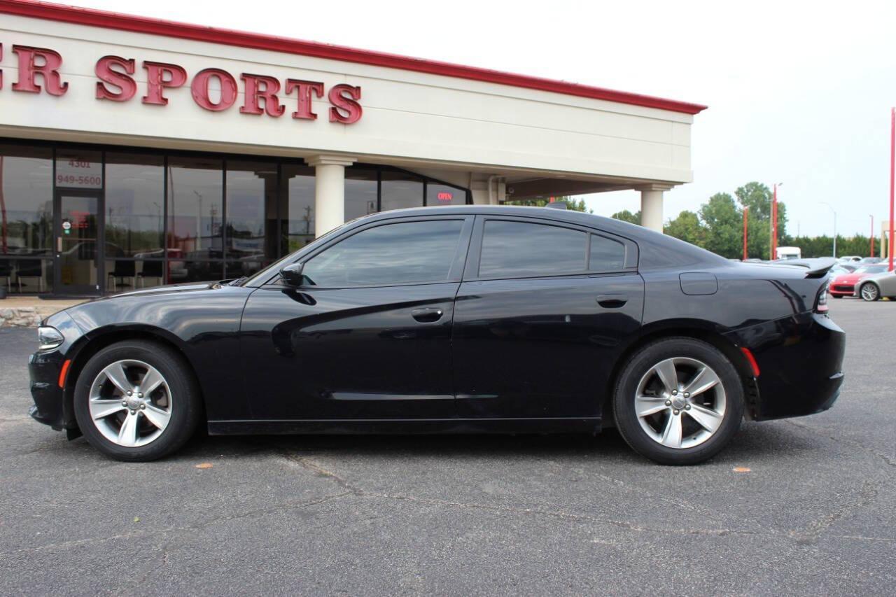 2018 Black Dodge Charger SXT (2C3CDXHG3JH) with an 3.6L V6 DOHC 24V engine, 8A transmission, located at 4301 NW 39th , Oklahoma City, OK, 73112, (405) 949-5600, 35.512135, -97.598671 - NO DRIVERS LICENCE NO-FULL COVERAGE INSURANCE-NO CREDIT CHECK. COME ON OVER TO SUPERSPORTS AND TAKE A LOOK AND TEST DRIVE. PLEASE GIVE US A CALL AT (405) 949-5600. NO LICENSIA DE MANEJAR- NO SEGURO DE COBERTURA TOTAL- NO VERIFICACCION DE CREDITO. POR FAVOR VENGAN A SUPERSPORTS, ECHE UN - Photo#5