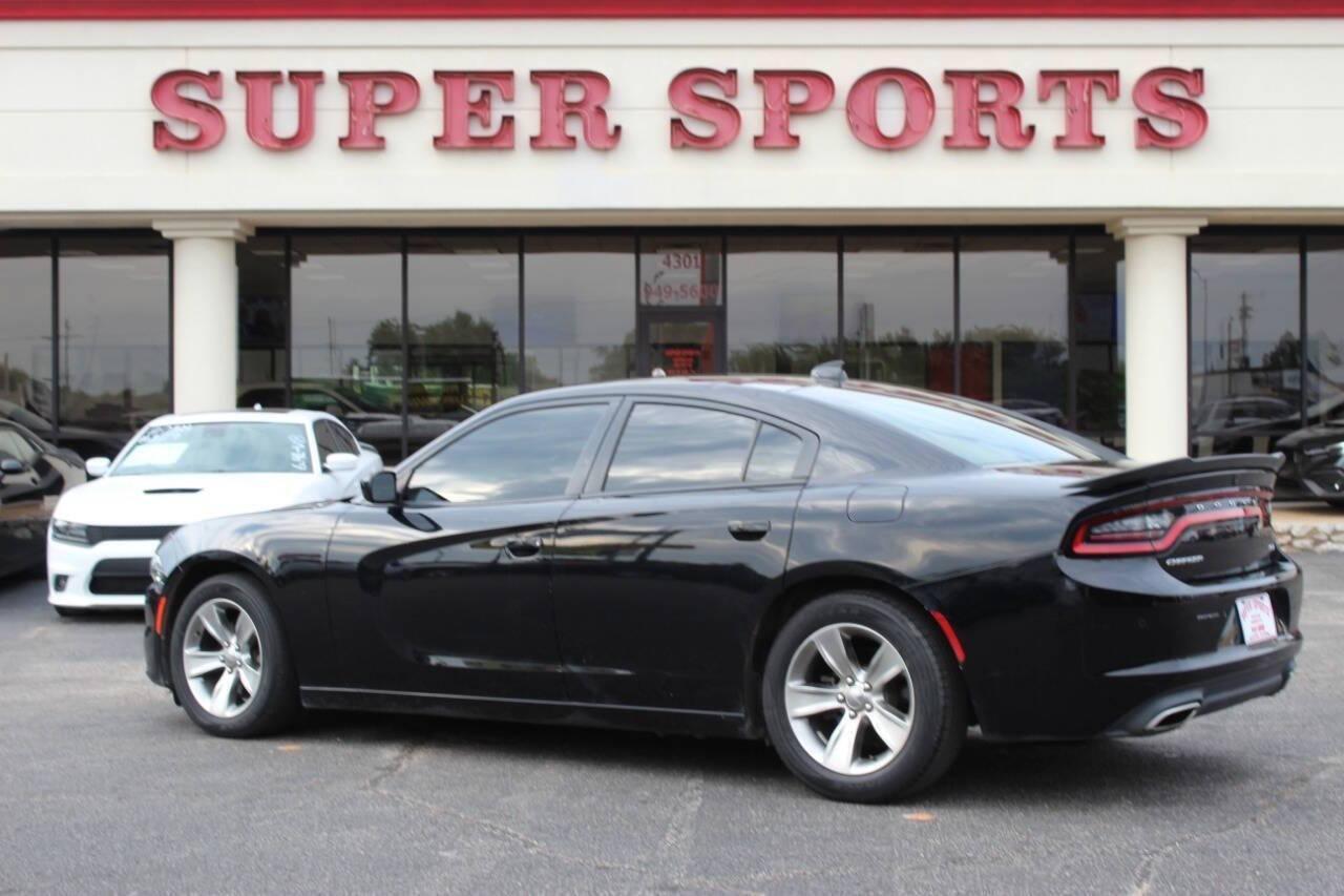 2018 Black Dodge Charger SXT (2C3CDXHG3JH) with an 3.6L V6 DOHC 24V engine, 8A transmission, located at 4301 NW 39th , Oklahoma City, OK, 73112, (405) 949-5600, 35.512135, -97.598671 - NO DRIVERS LICENCE NO-FULL COVERAGE INSURANCE-NO CREDIT CHECK. COME ON OVER TO SUPERSPORTS AND TAKE A LOOK AND TEST DRIVE. PLEASE GIVE US A CALL AT (405) 949-5600. NO LICENSIA DE MANEJAR- NO SEGURO DE COBERTURA TOTAL- NO VERIFICACCION DE CREDITO. POR FAVOR VENGAN A SUPERSPORTS, ECHE UN - Photo#4