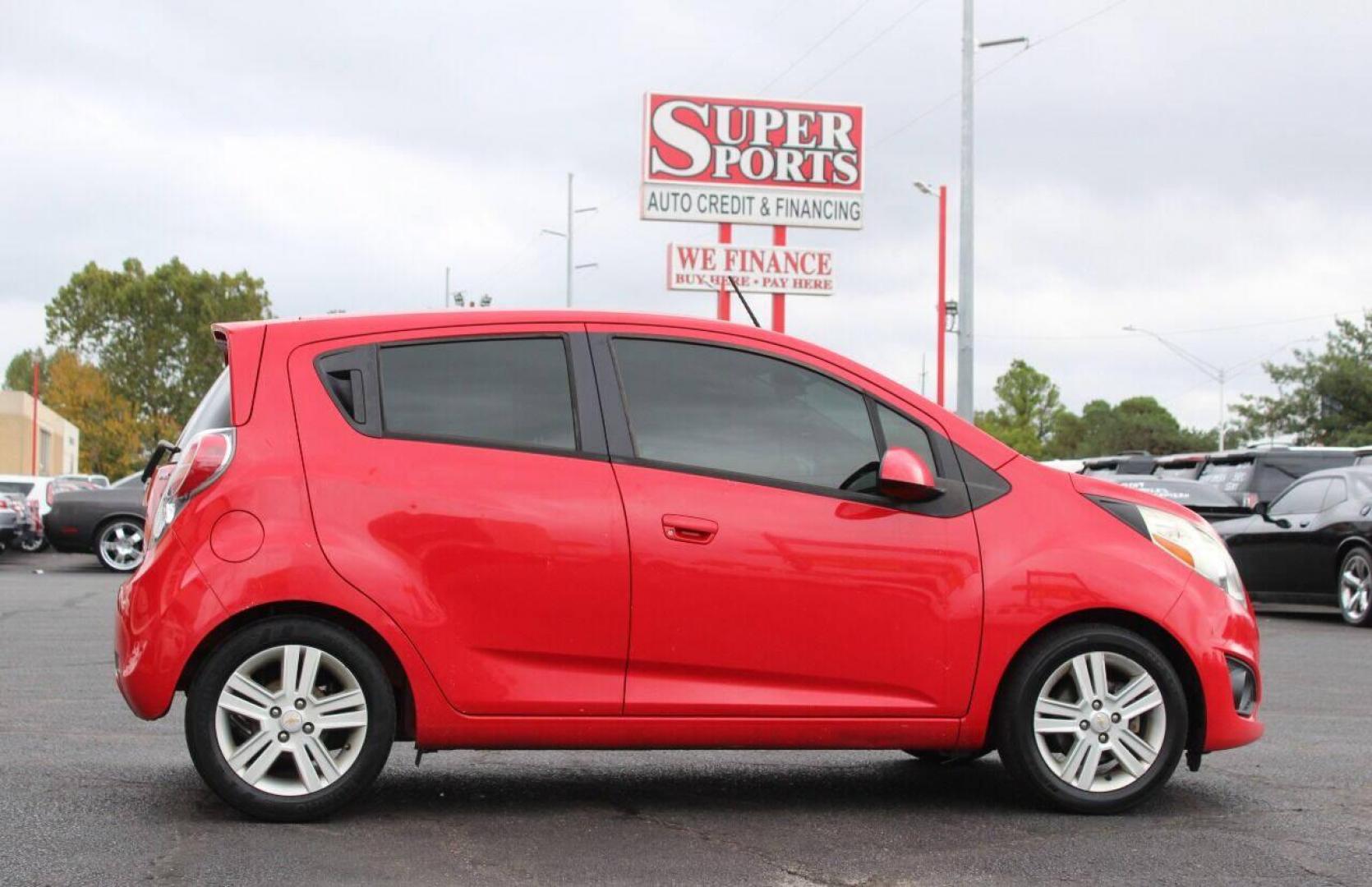 2013 Red Chevrolet Spark LS Manual (KL8CA6S95DC) with an 1.2L L4 16V DOHC engine, 5-Speed Manual transmission, located at 4301 NW 39th , Oklahoma City, OK, 73112, (405) 949-5600, 35.512135, -97.598671 - Photo#4